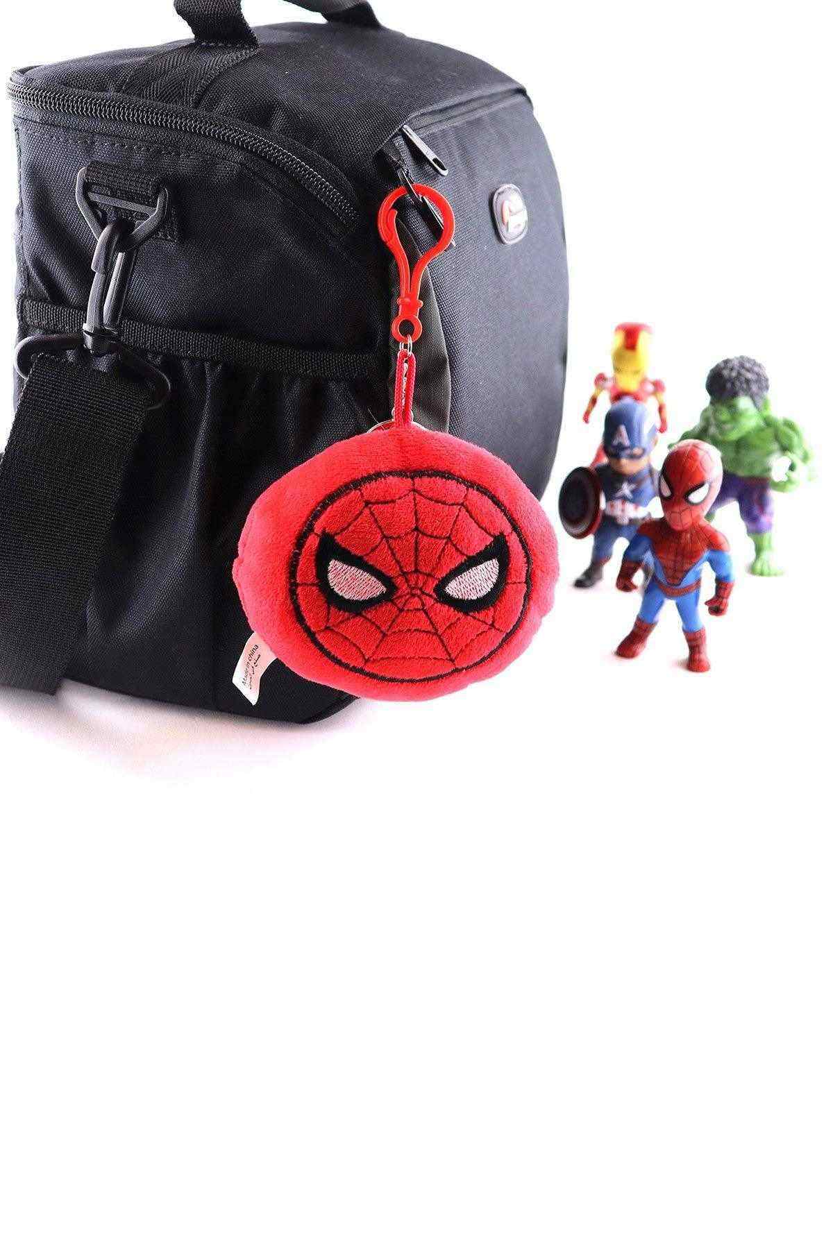 Spider-Man plush keychain attached to a black bag, red round face with web pattern