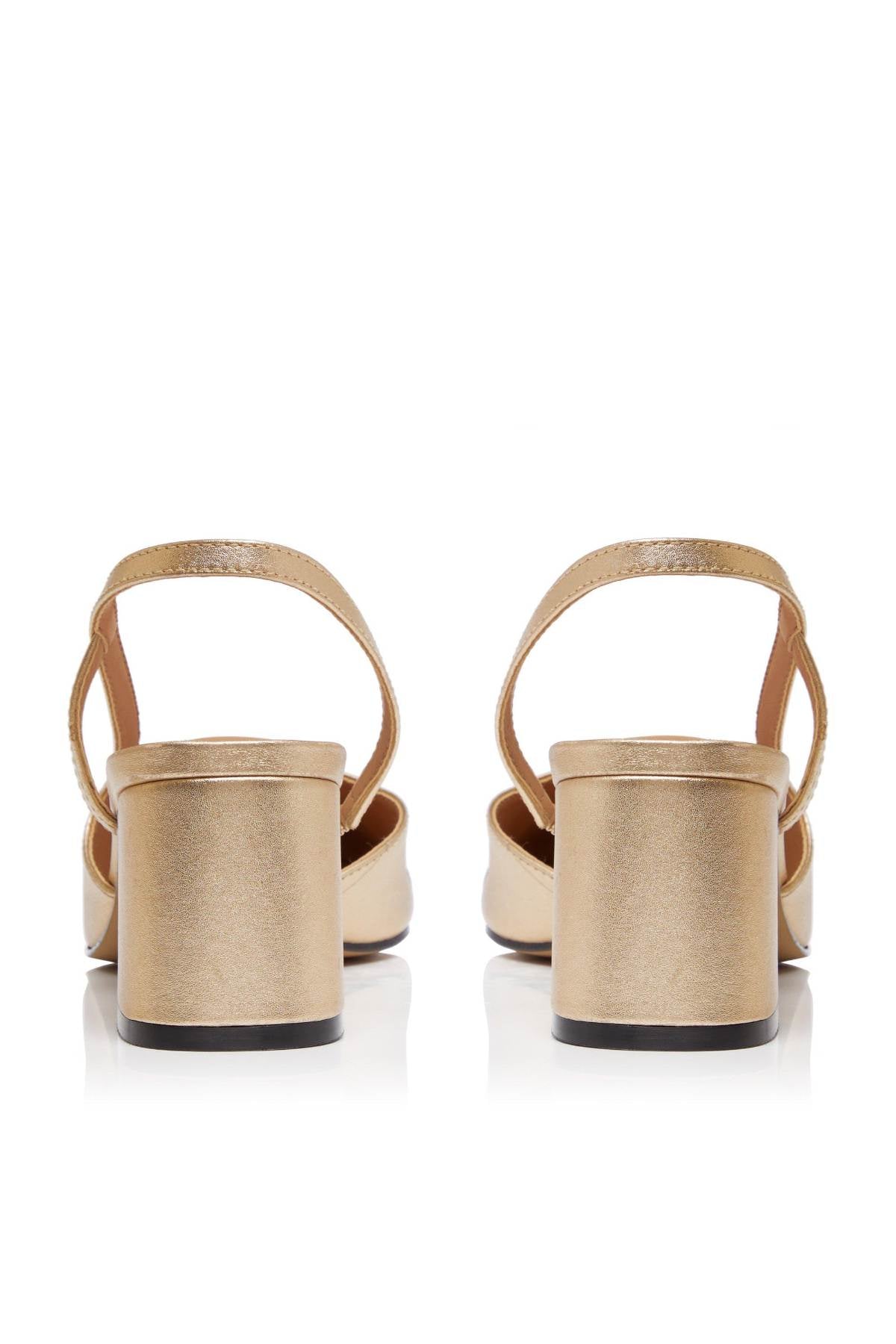 Dune London champagne metallic slingback heels with black toe cap, rear view