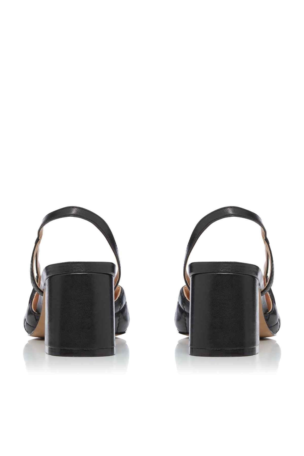 Dune London black heeled slingback sandals from back view with ankle strap