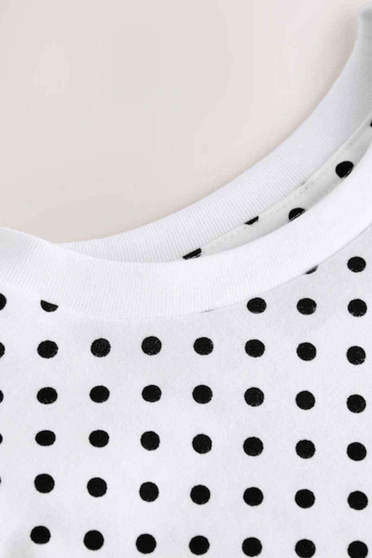 Kids white T-shirt neckline and hem with black dot pattern detail