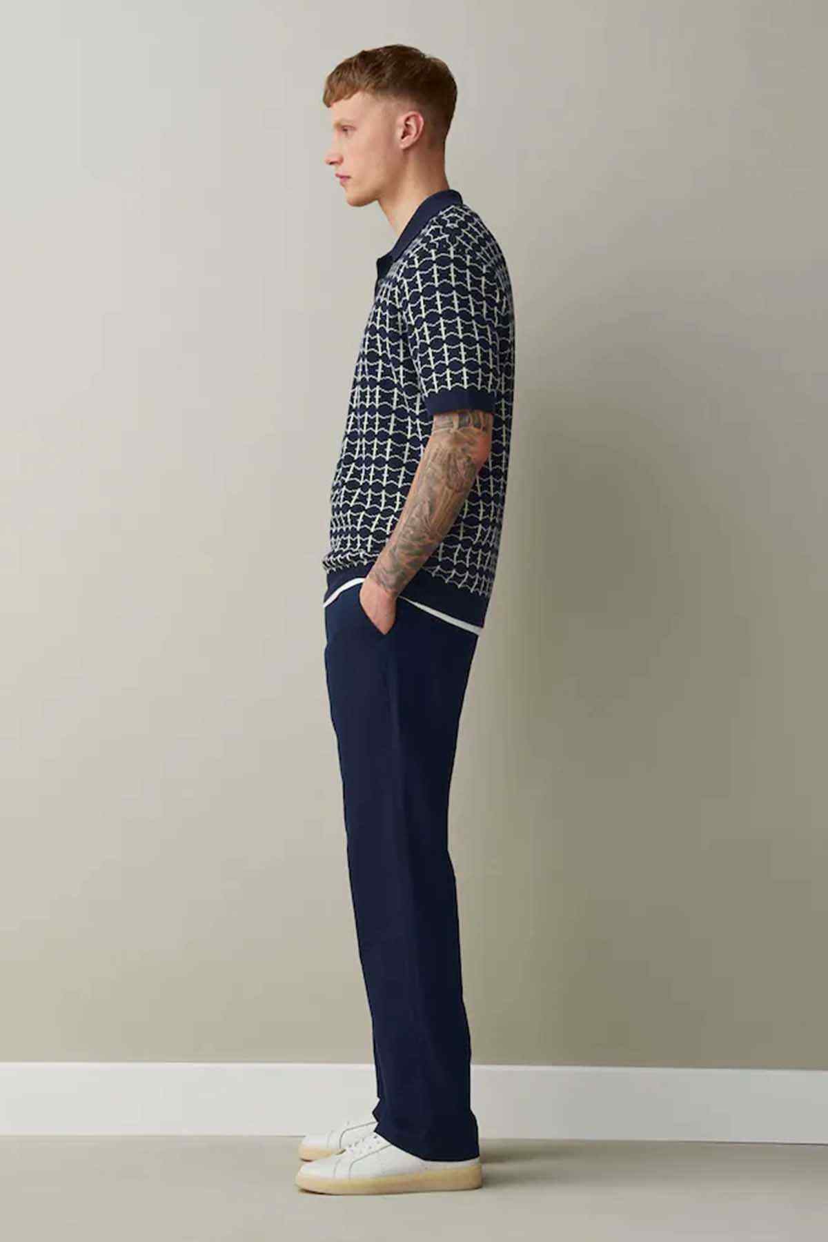 Navy straight-leg trousers side view with belt loops and button closure