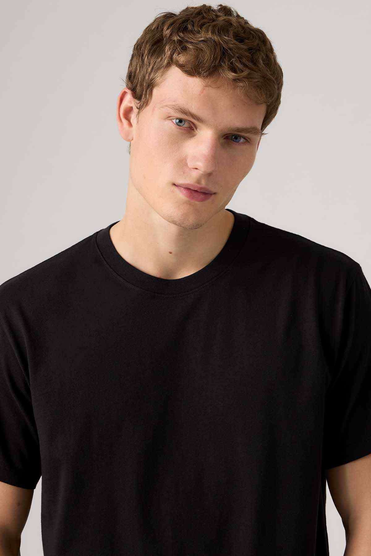 Black crew-neck T-shirt close-up, short sleeves, plain fabric