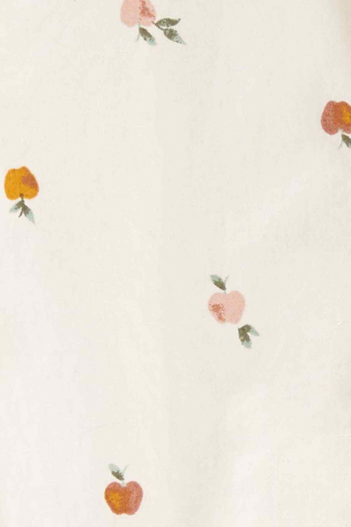 Close-up baby fabric: cream with small fruit floral print