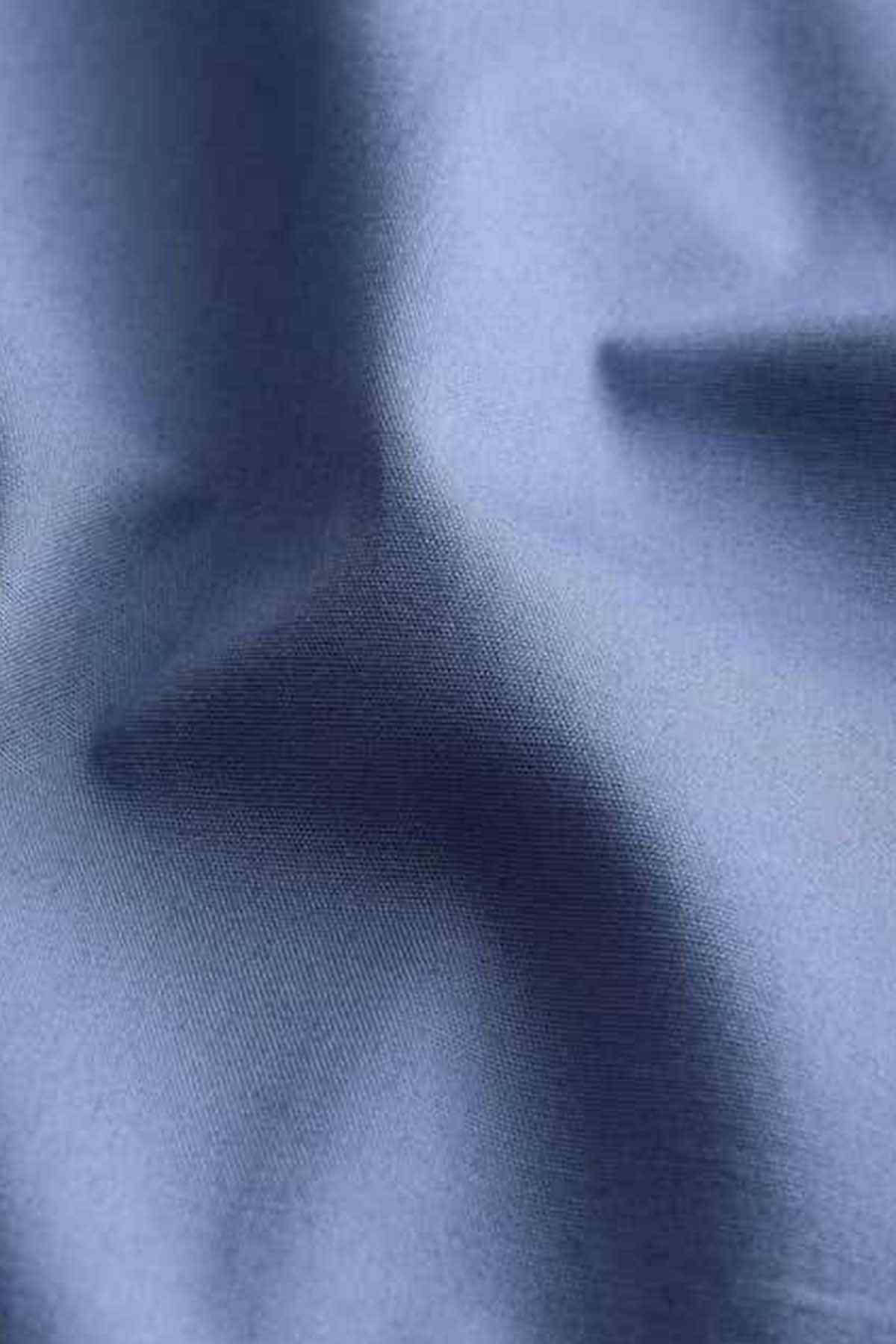 Blue dress shirt fabric close-up