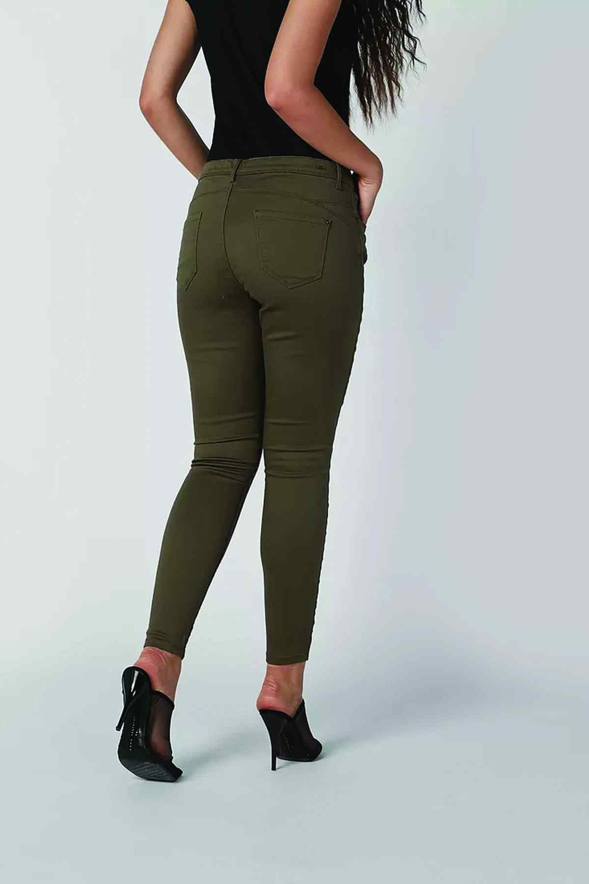 Olive green slim-fit jeans back view with welt pockets and tapered legs