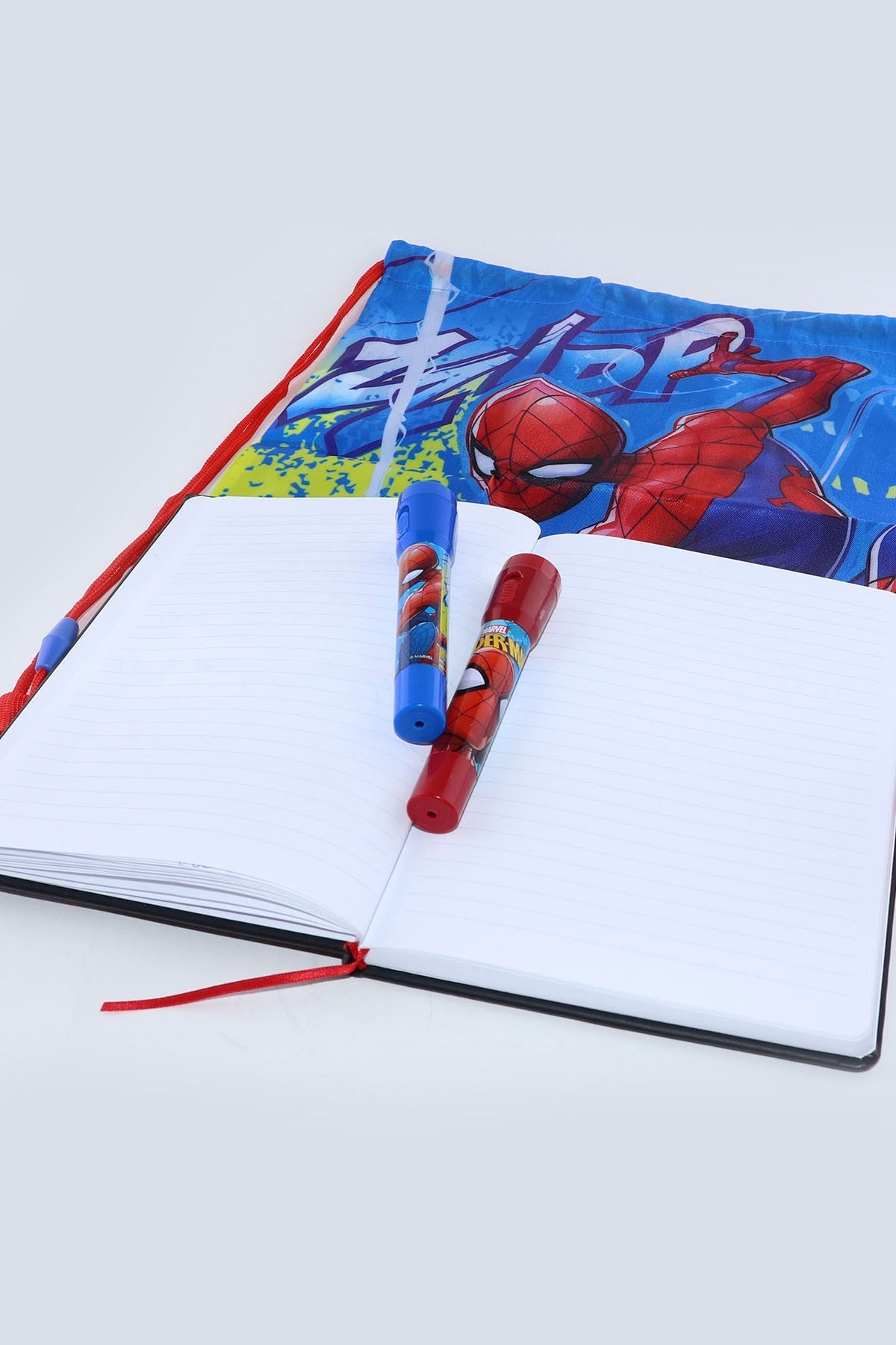 Spider-Man themed notebook with two pens resting on the open pages