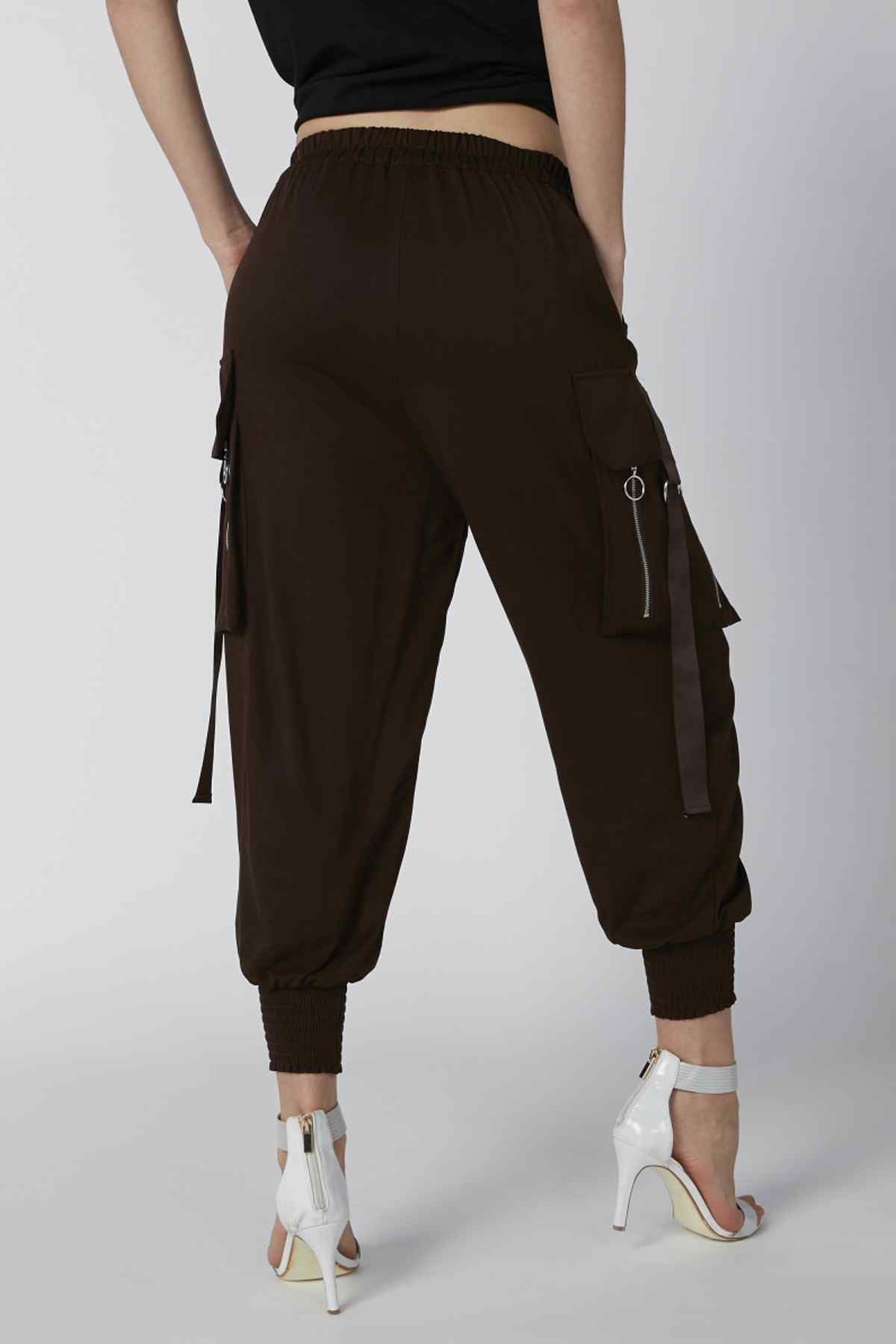 Brown cargo jogger pants with side pockets, tassel ties, and cropped elastic hem