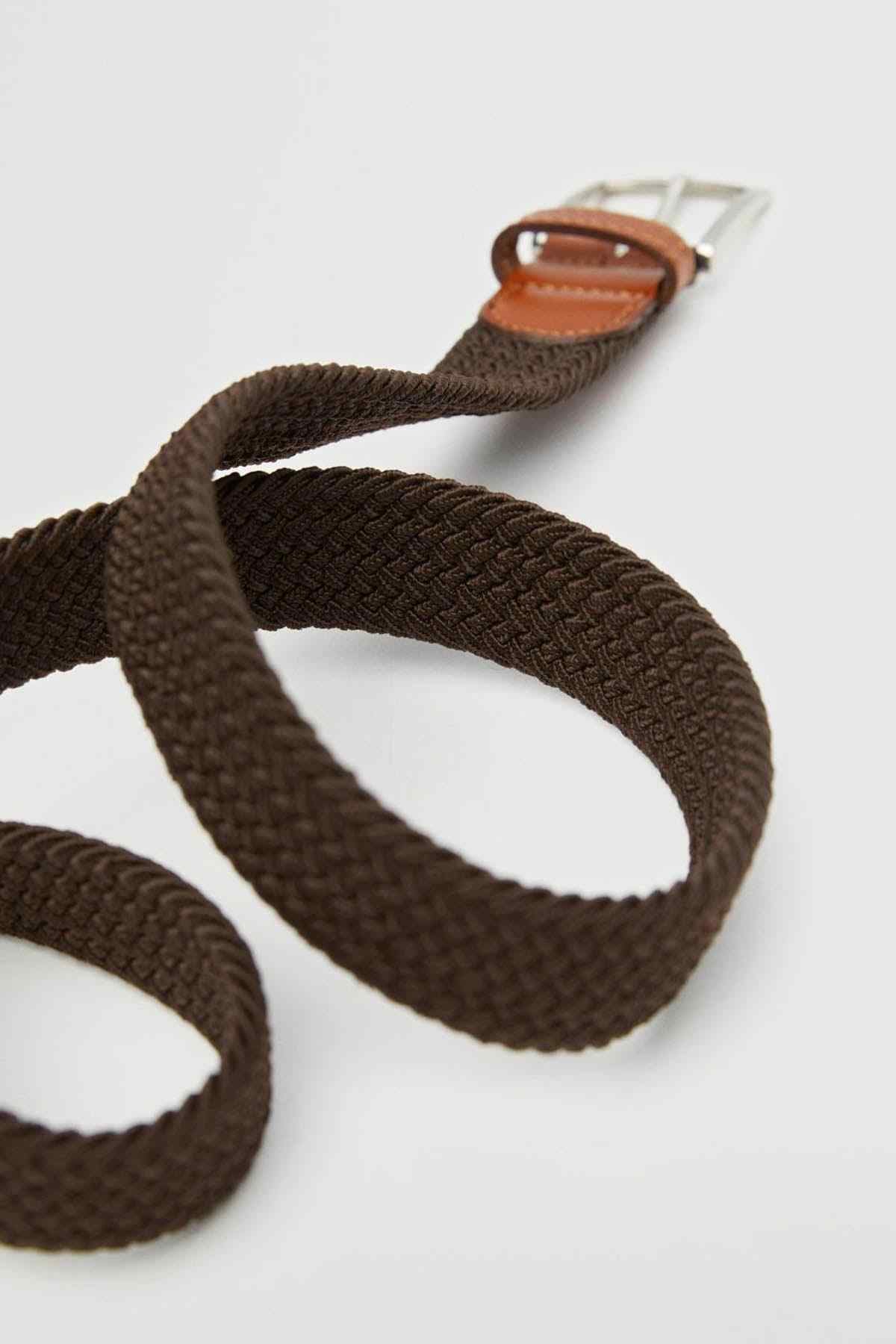 Braided belt strap with tan leather keeper and silver buckle prong