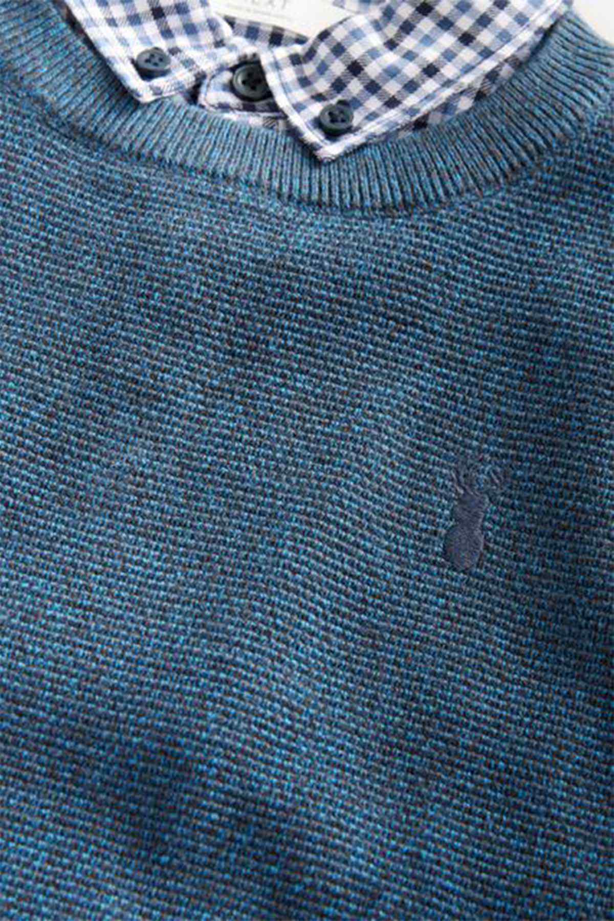 Navy textured knit sweater detail with checked collar and small button