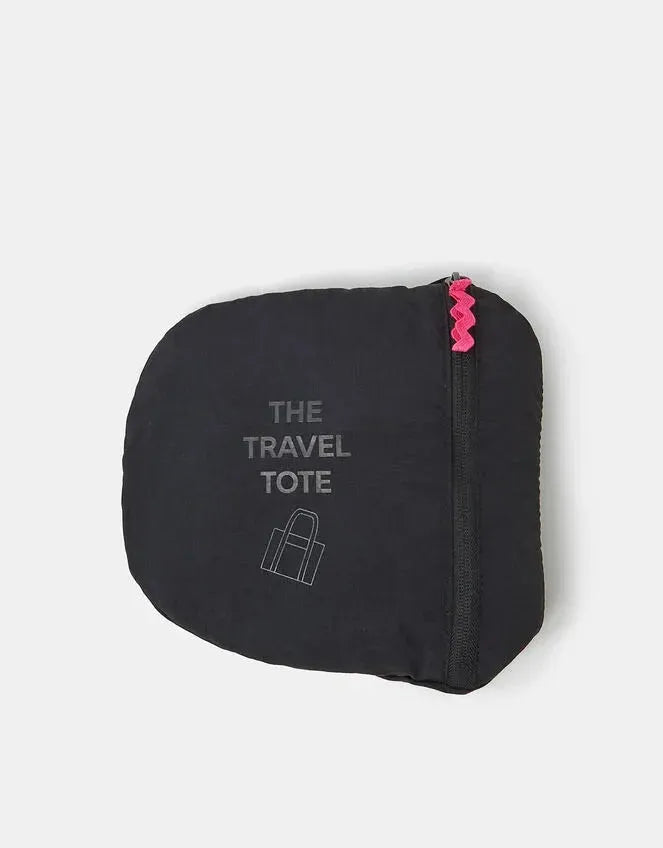 Black travel tote pouch with pink zipper detail and “THE TRAVEL TOTE†text