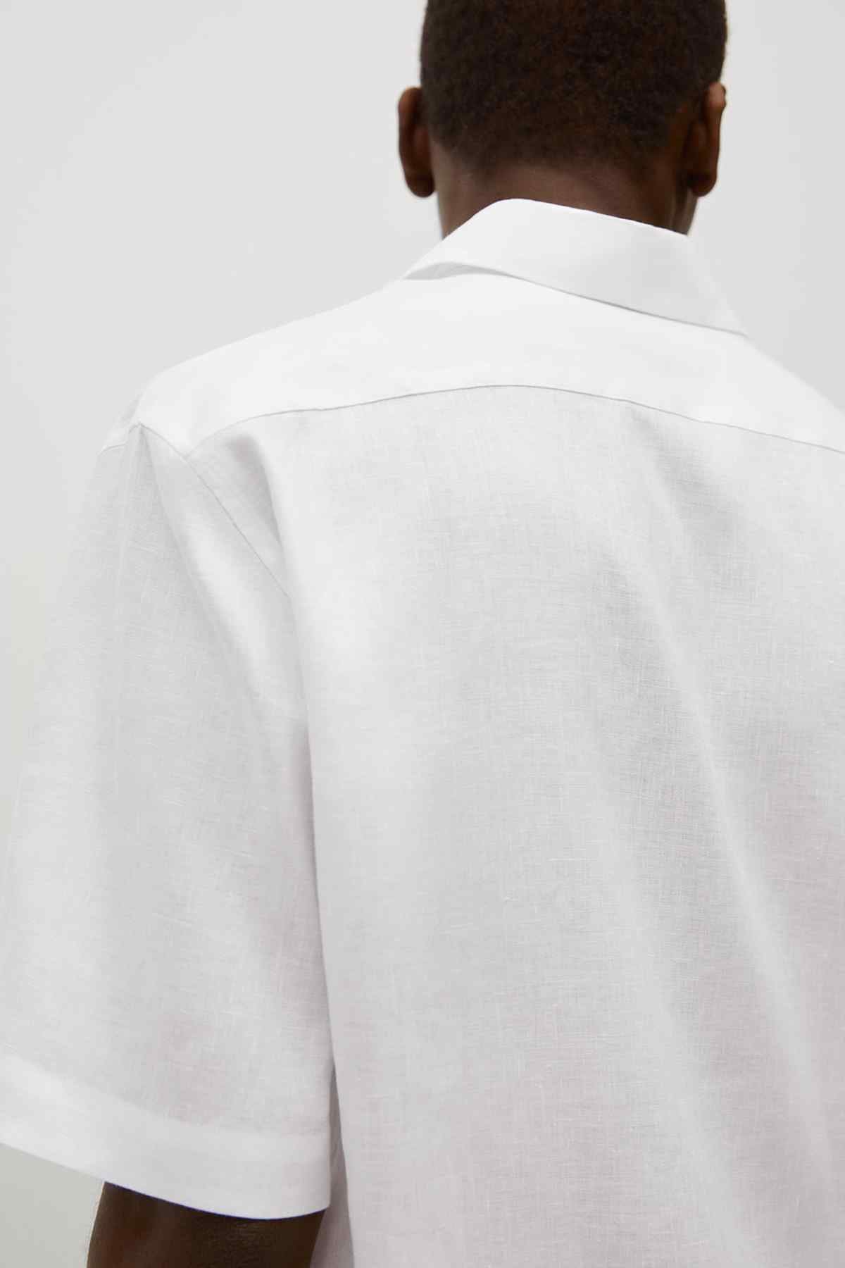 White short-sleeve button-up shirt, back view with pointed collar