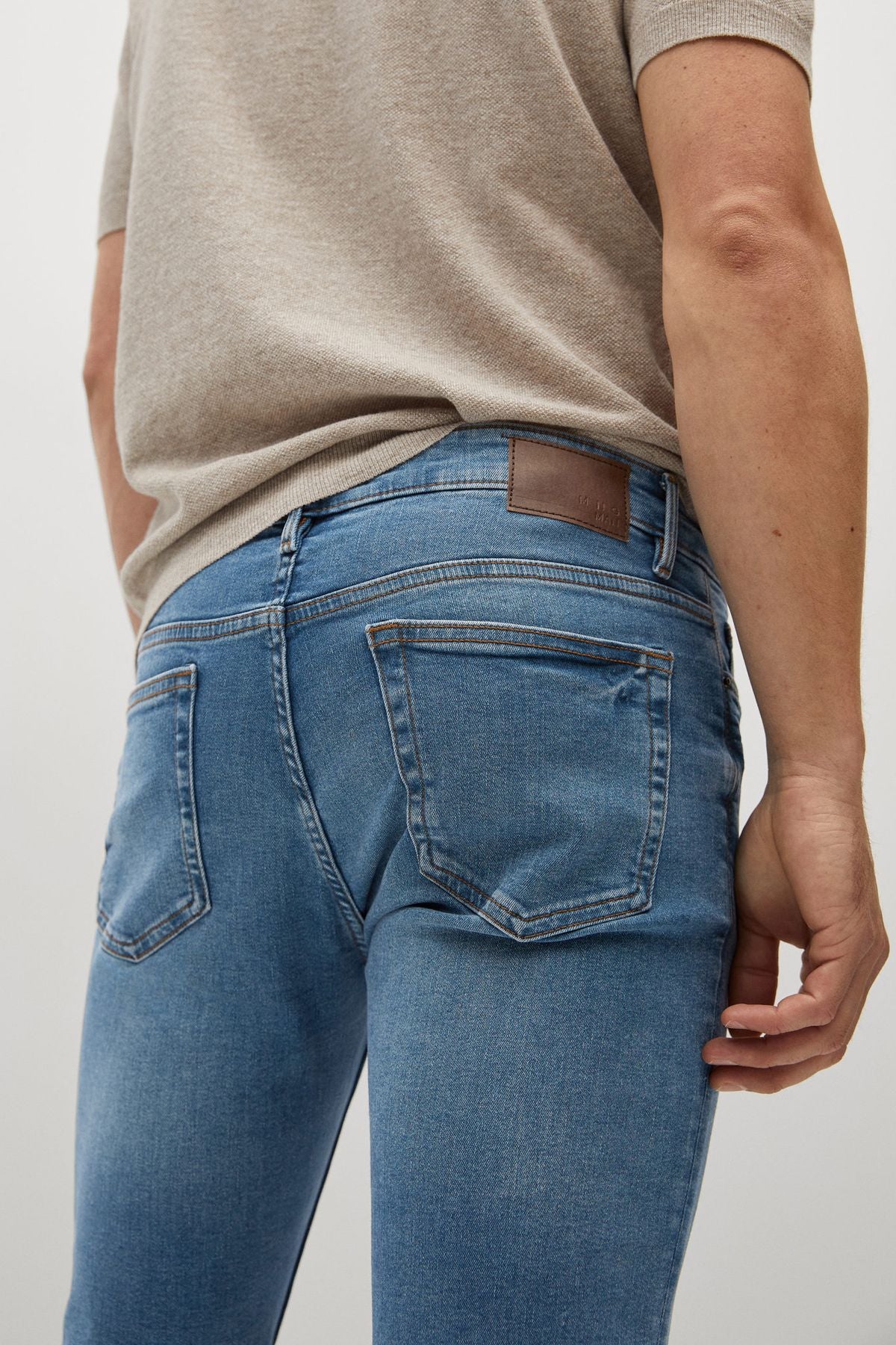 Blue denim jeans with back patch pocket and belt loops