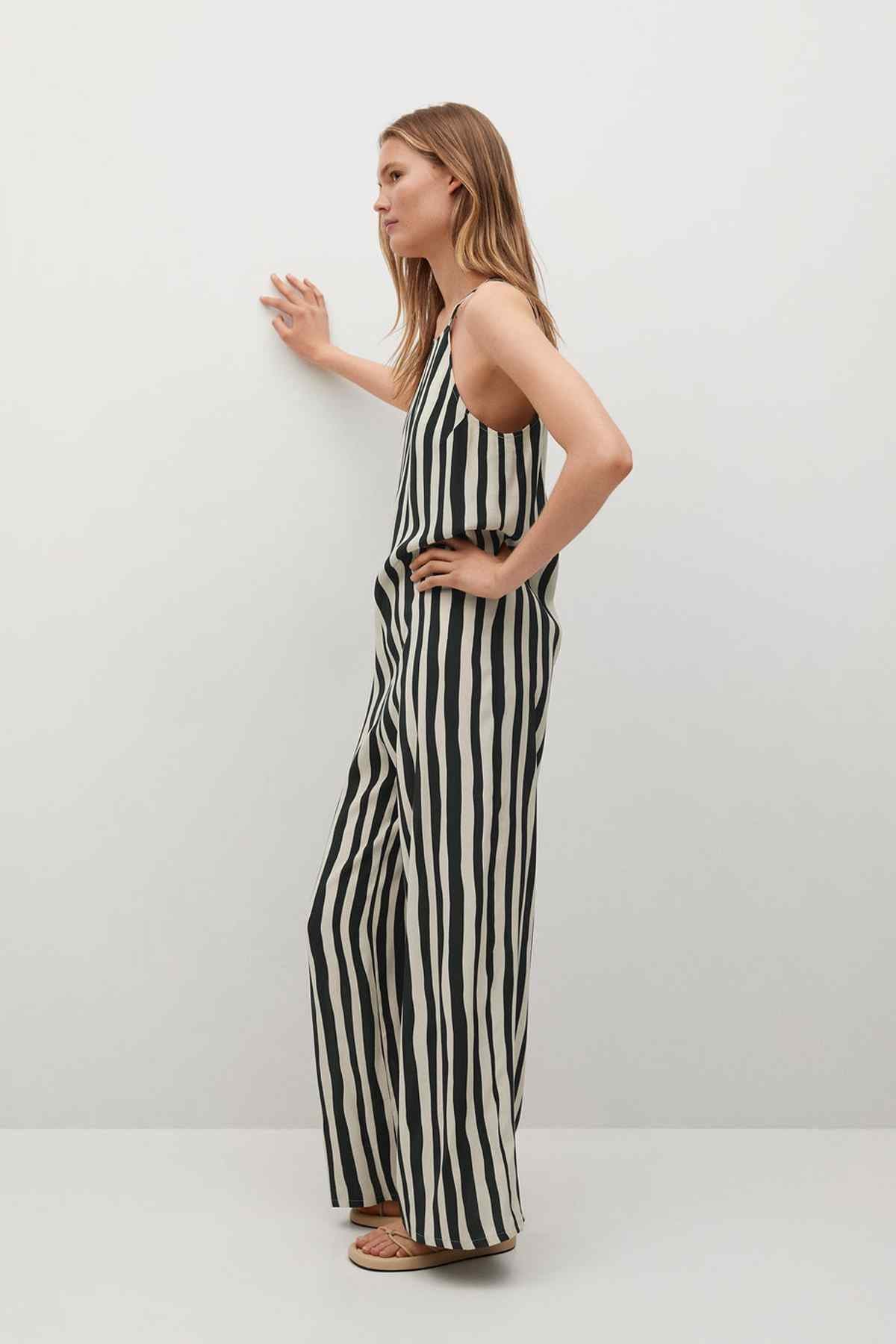 Mango sleeveless vertical striped jumpsuit, black and white, side view
