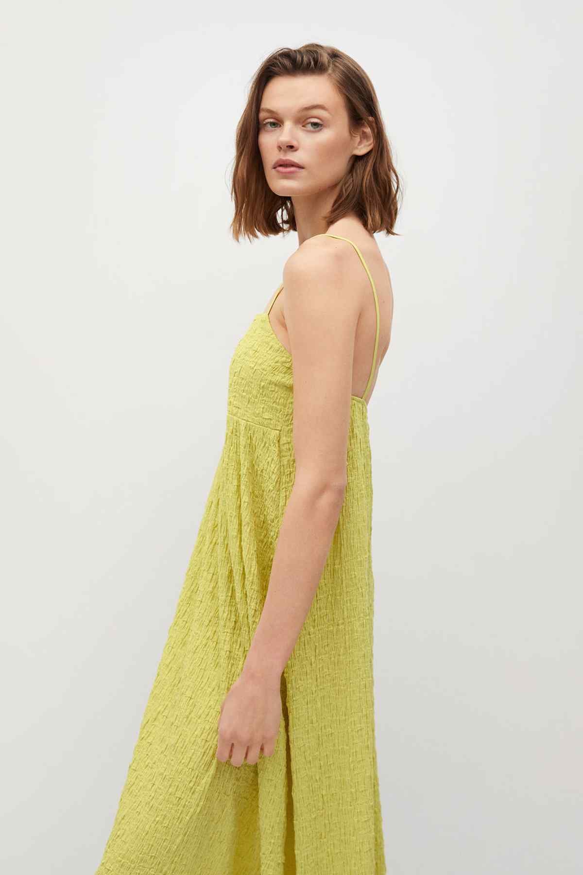 Green textured cami dress with thin straps and gathered skirt, side view
