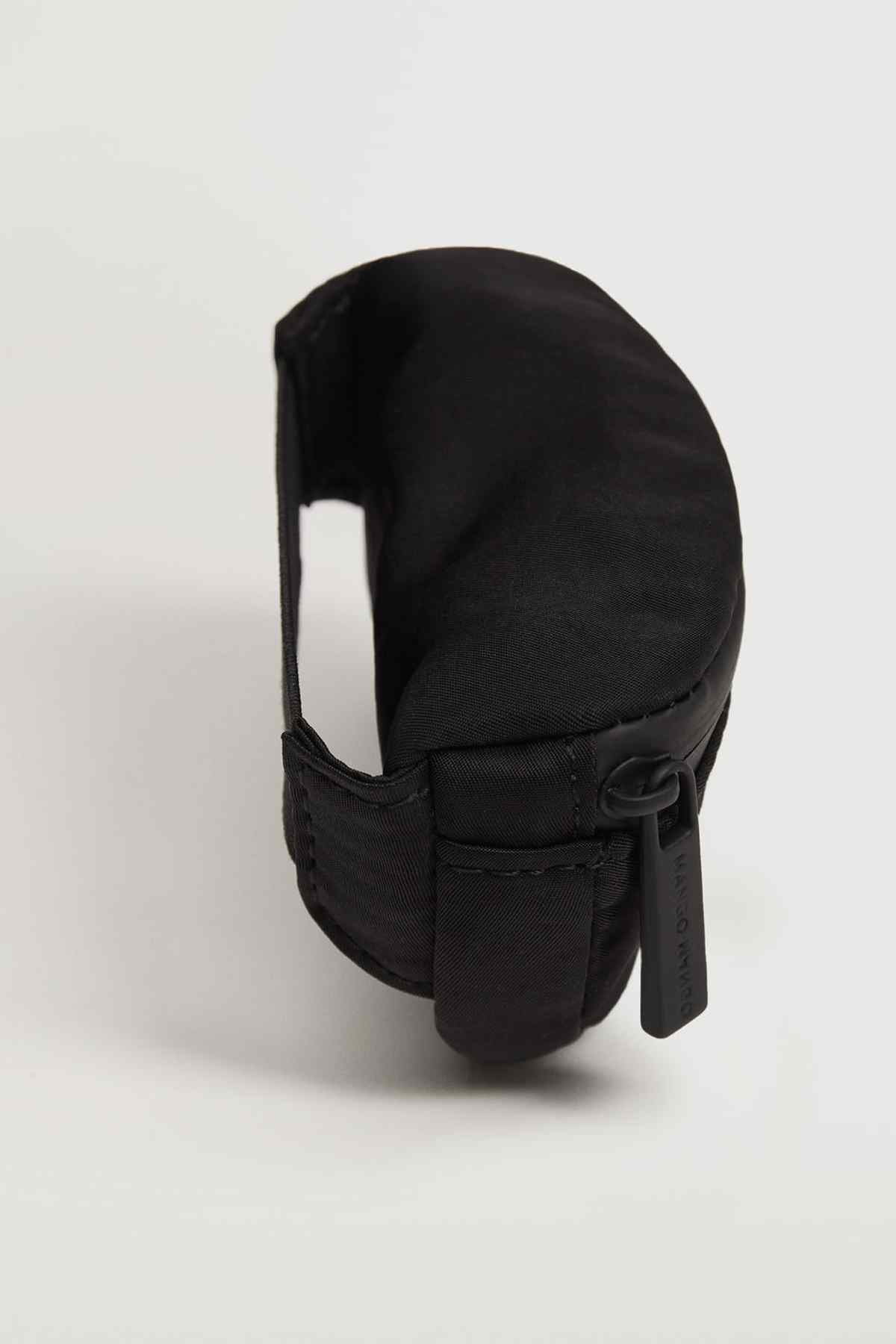 Black belt bag close-up with strap loop and side pocket detail