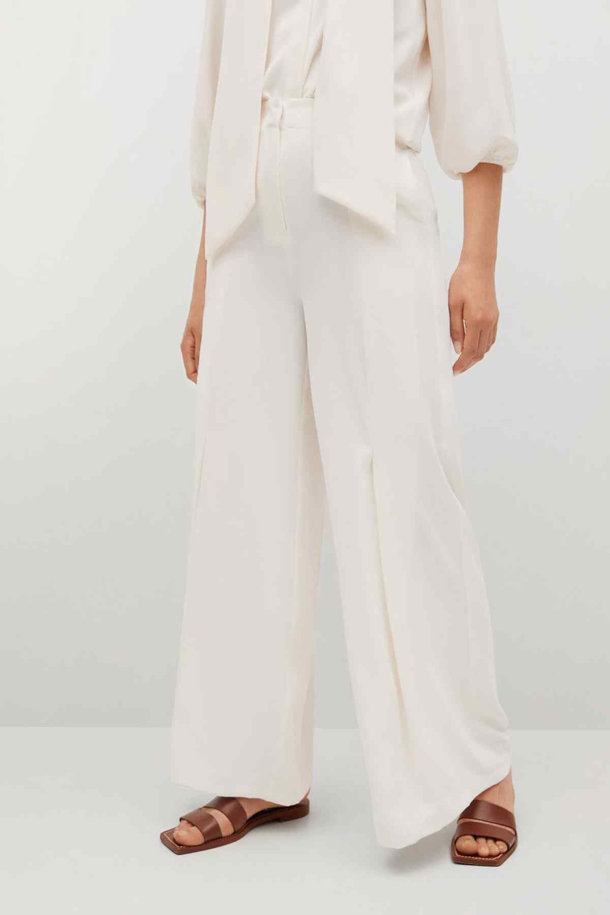Off-white wide-leg trousers with button front, full length view