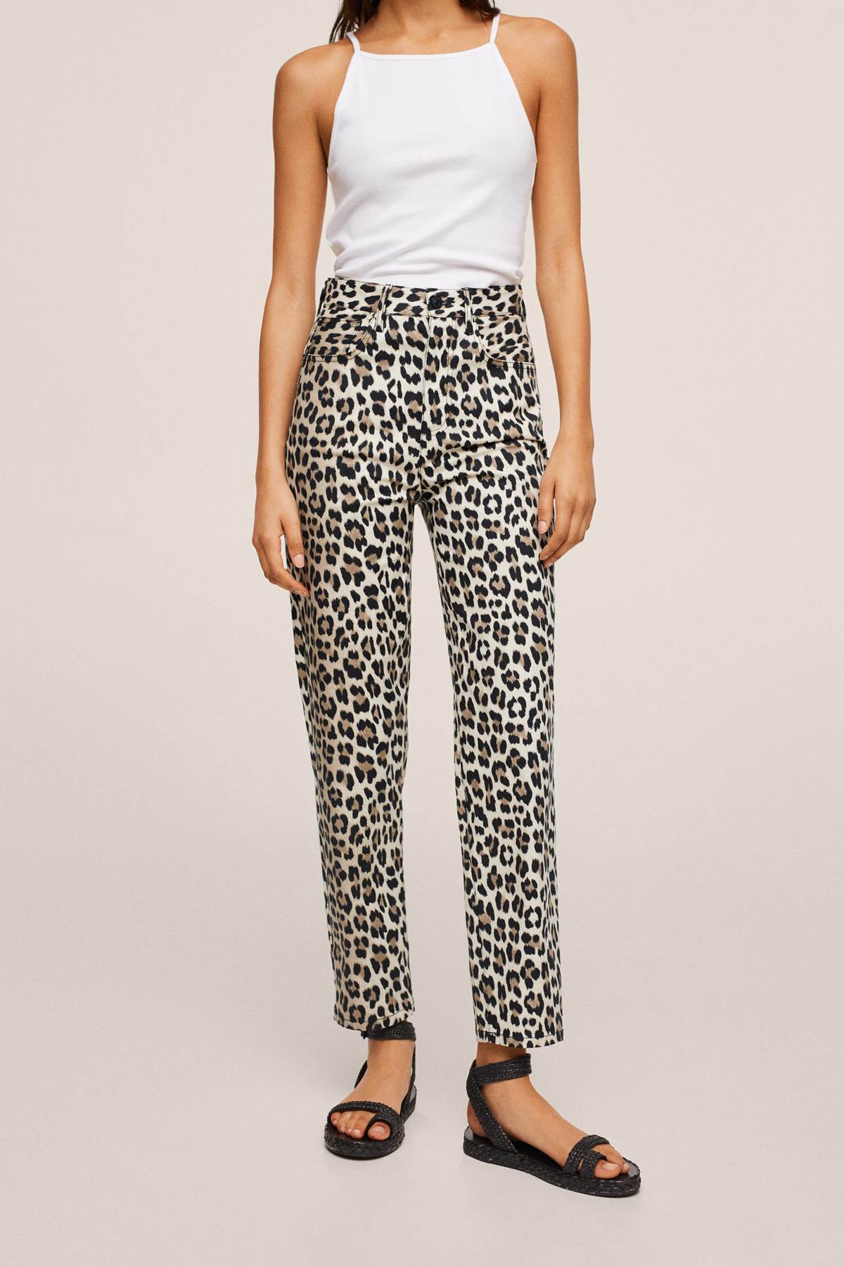 White halter tank top with beige leopard print straight-leg pants and sandals