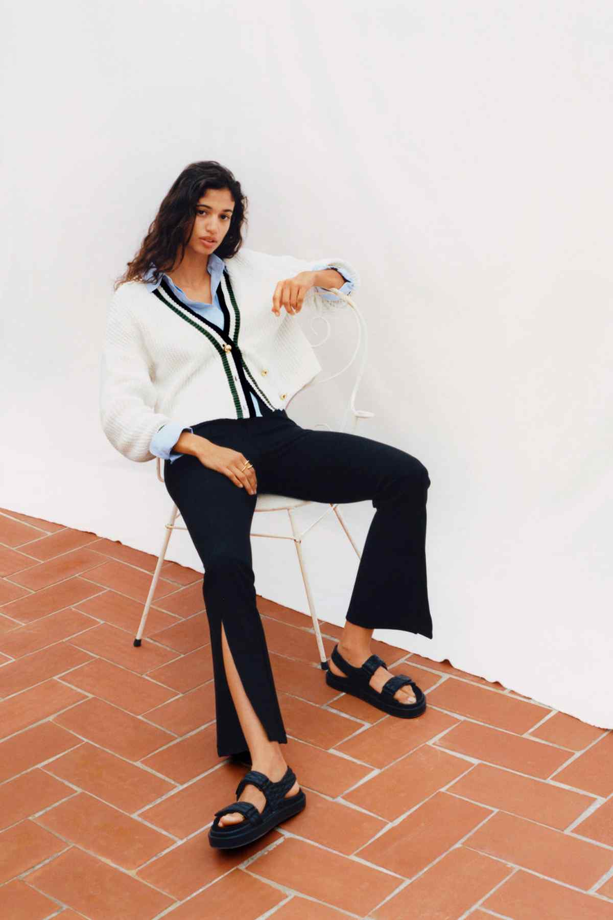 Black flared pants with split hem and wide leg opening