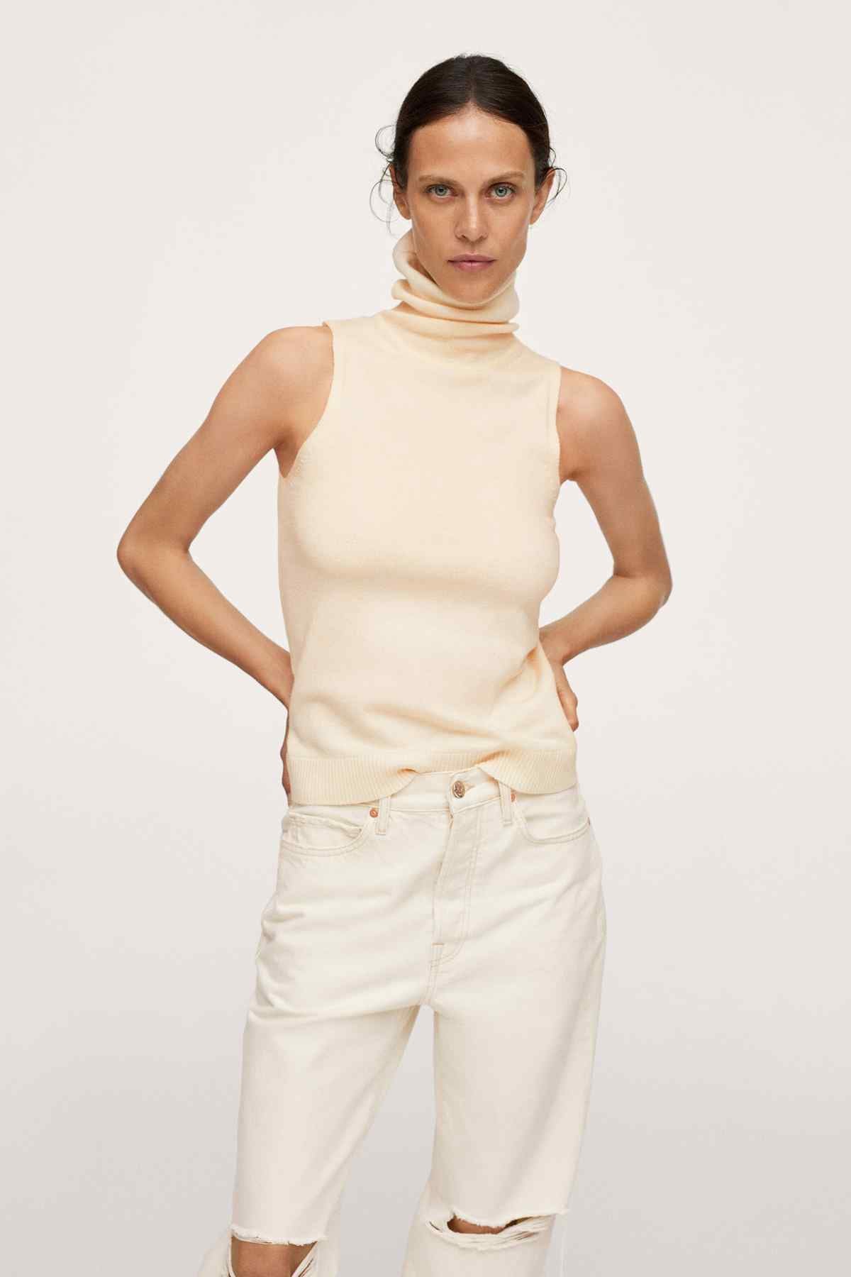 Vanilla sleeveless mock-neck top with sleeveless cut and fitted waist