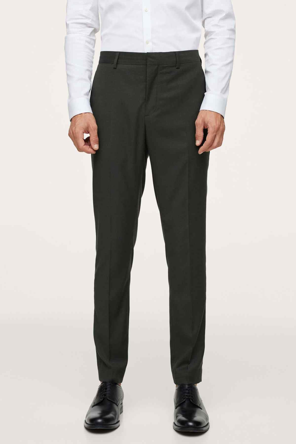 Men's dark green suit trousers with belt loops and crease
