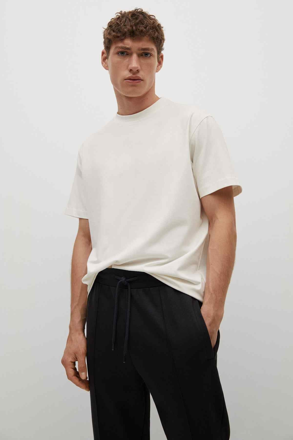 Black drawstring trousers with side pockets and tapered fit