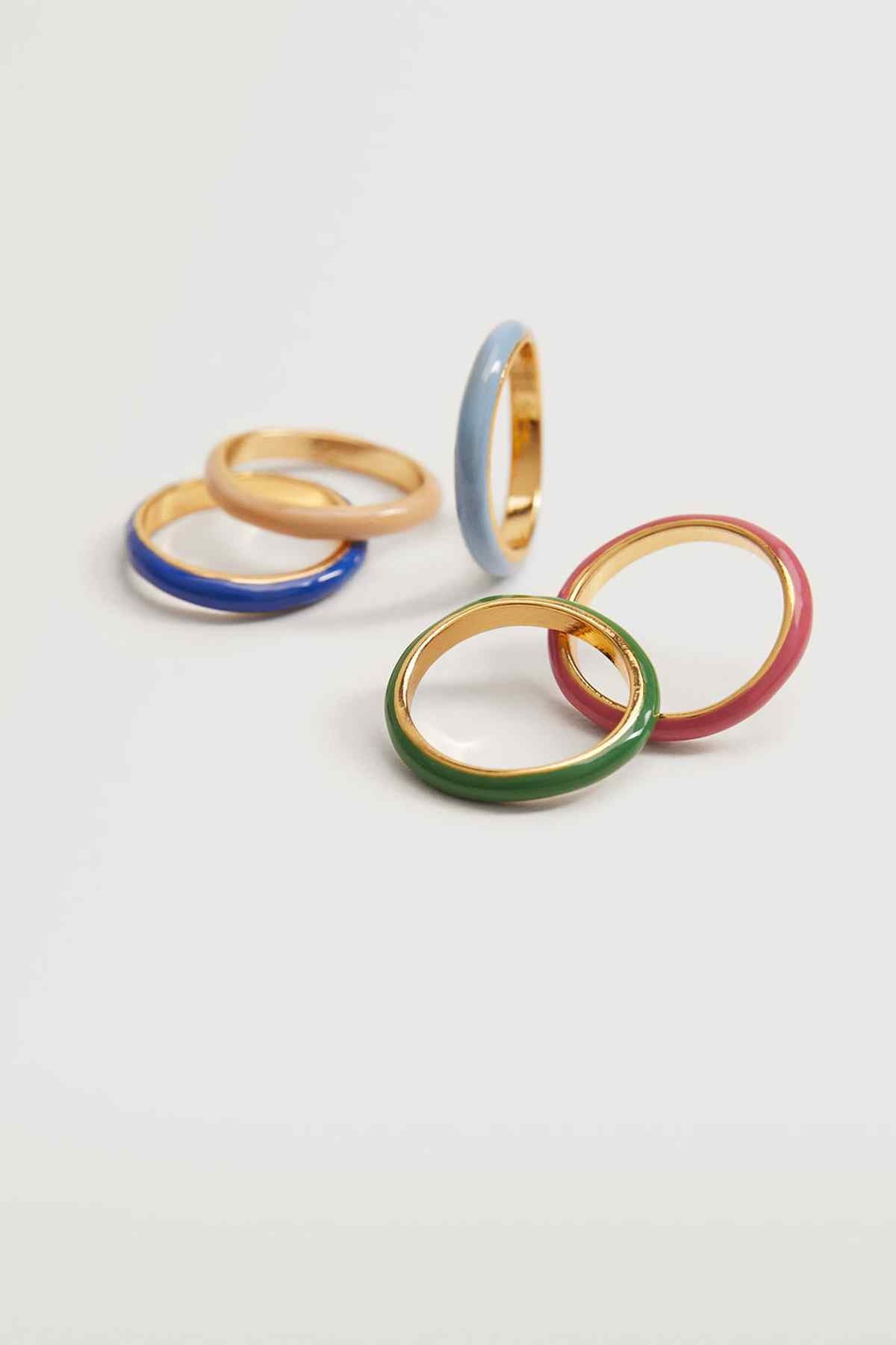 MANGO enamel rings close-up with gold, blue, pink, and green bands.