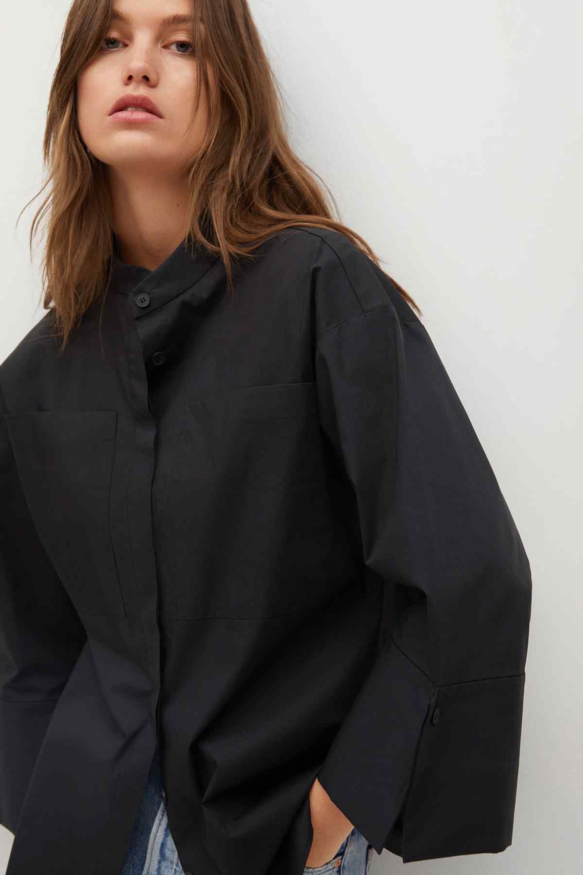 Black jacket with flap pocket detail and loose sleeves
