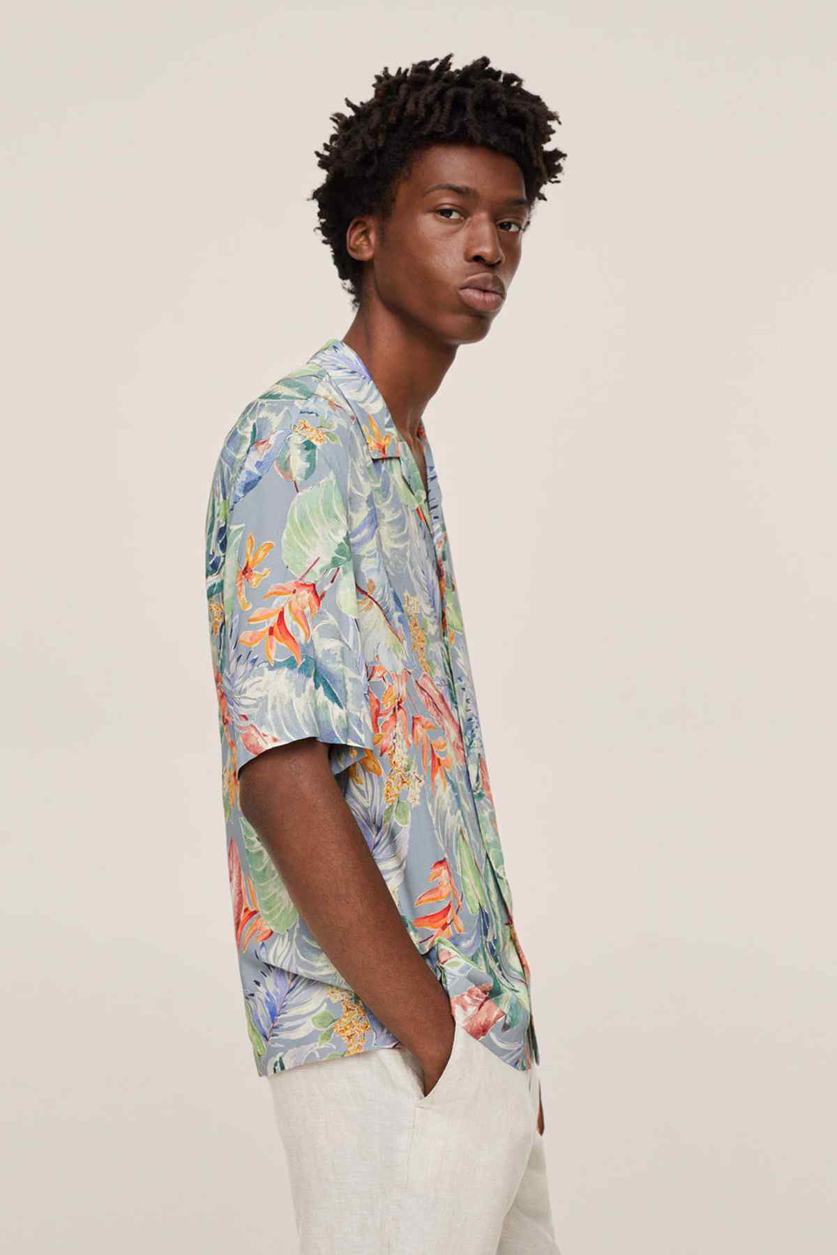 Mango tropical print short-sleeve shirt, side view, light blue with orange and green plants
