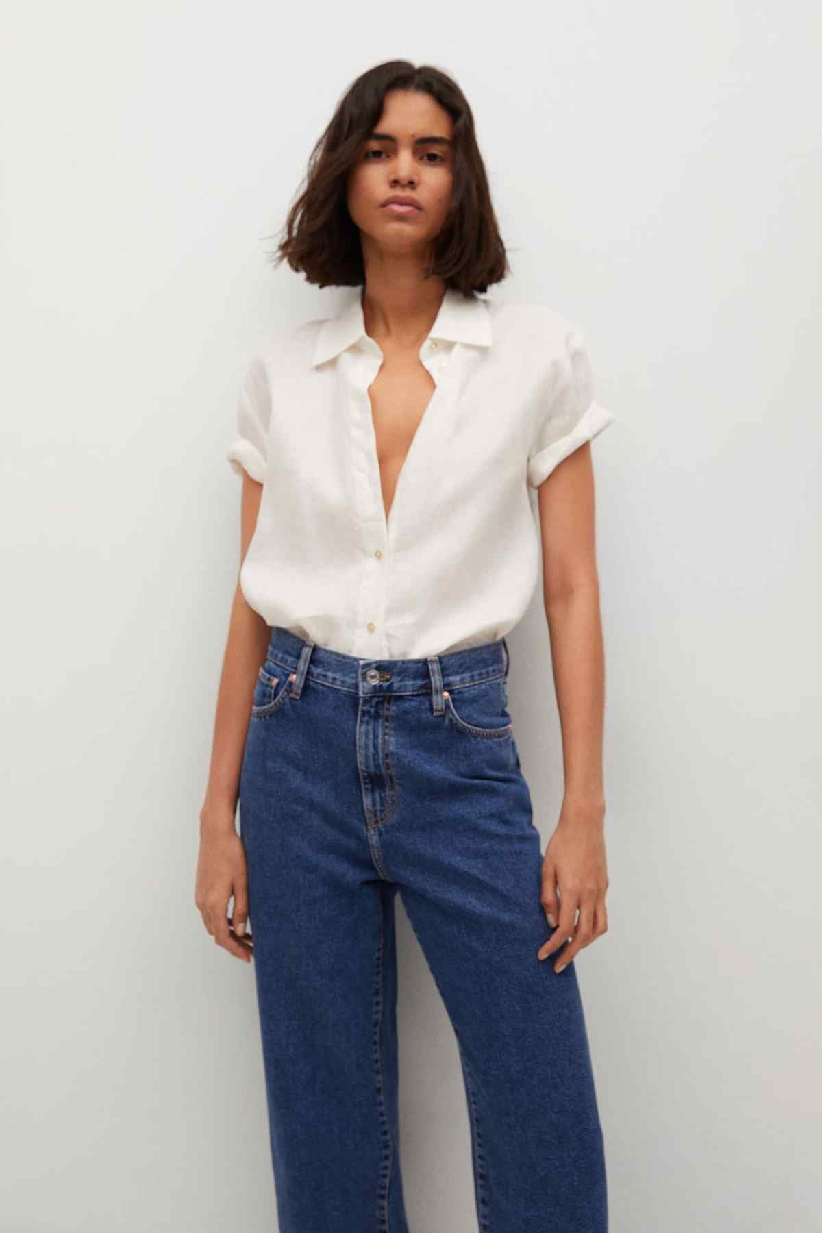 Dark blue denim mid-rise cropped jeans with straight legs and button fly