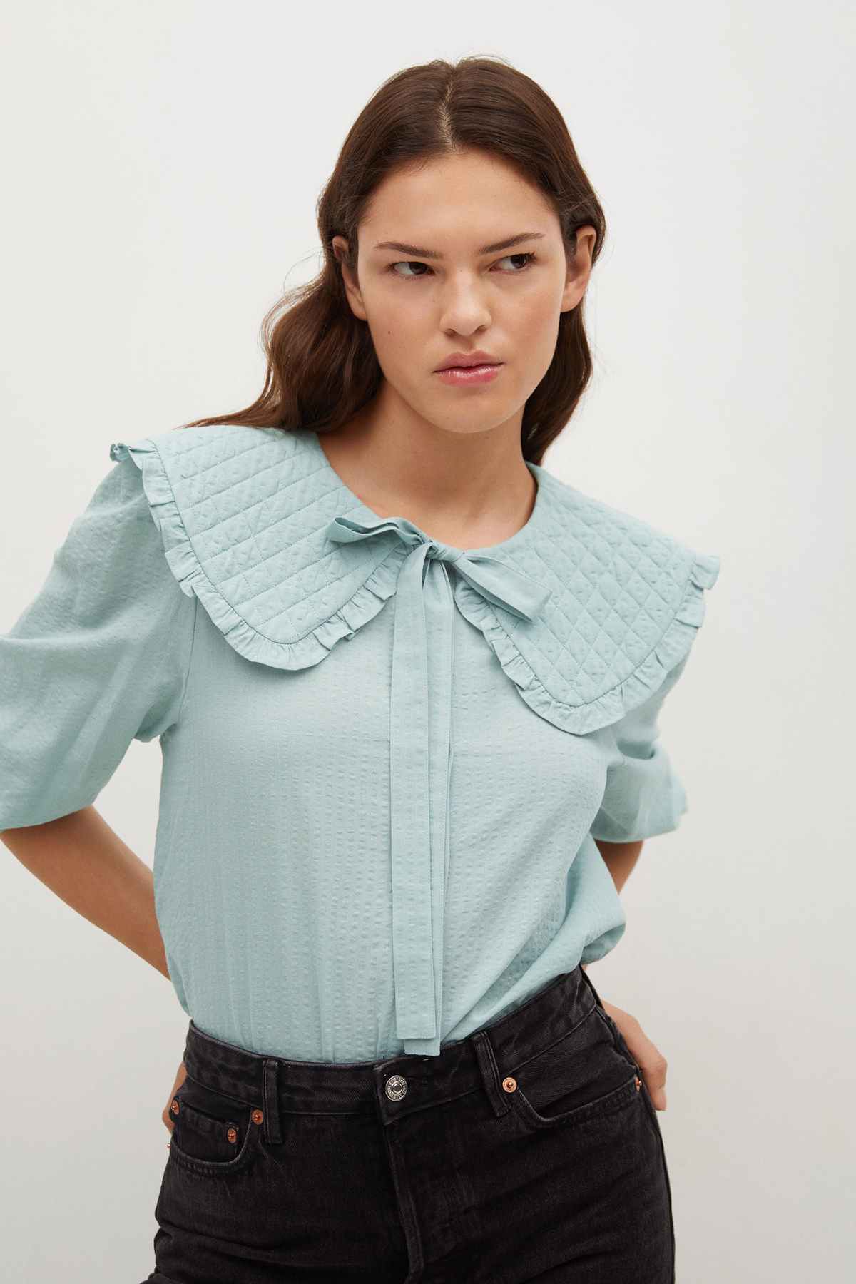 Pastel green quilted blouse with ruffled Peter Pan collar and bow