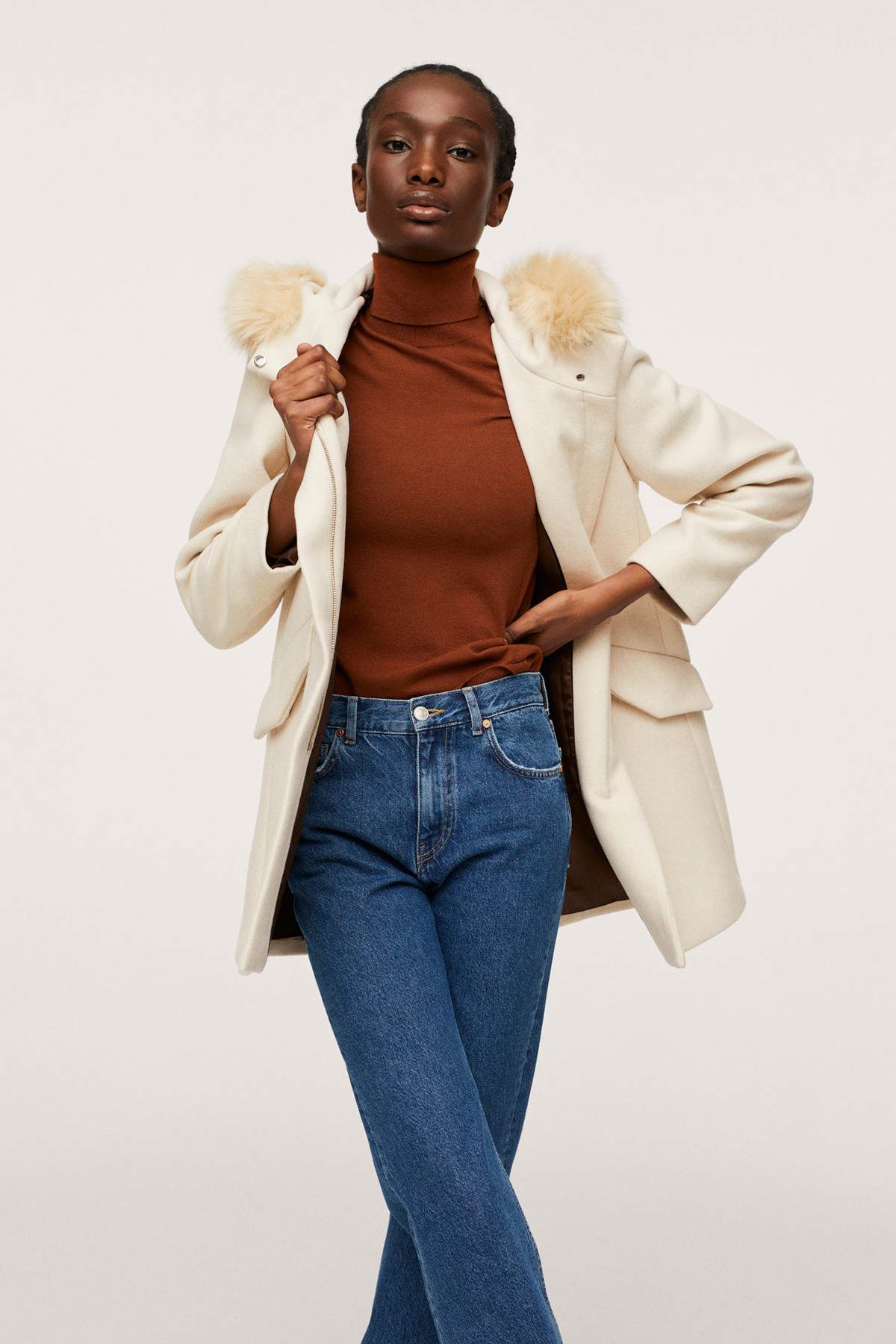 Ecru hooded coat with faux fur collar, open front over brown top