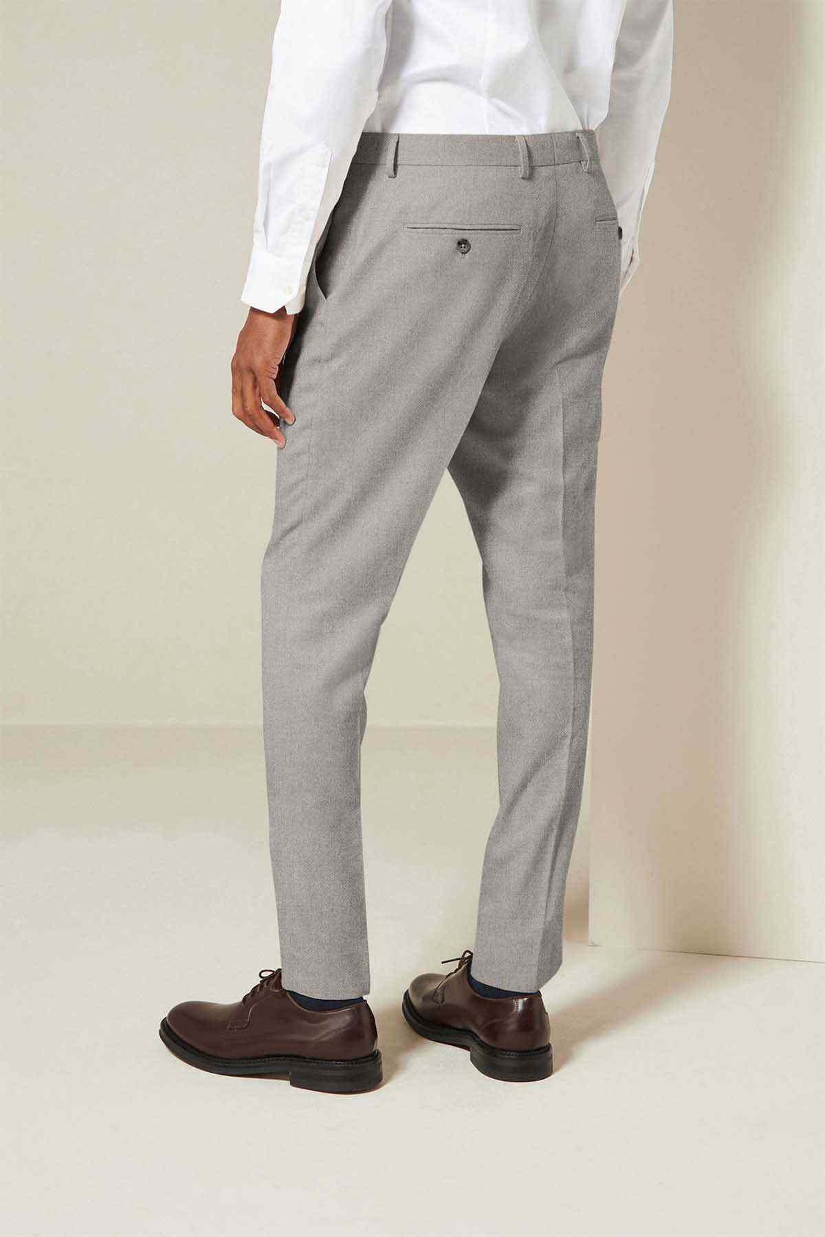 Grey suit trousers with straight cut and front crease, belt loops and pockets