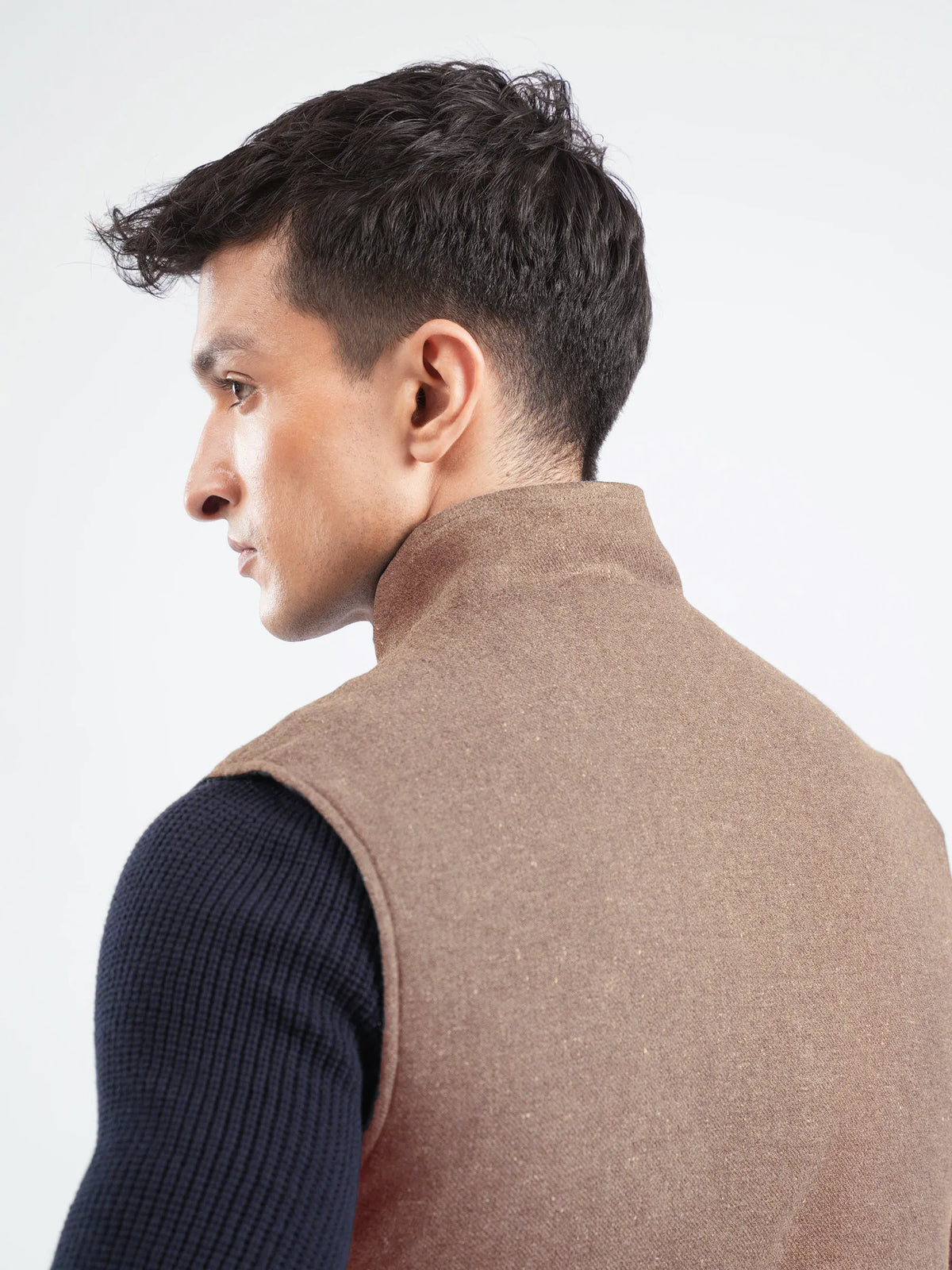 Brumano brown vest back view with high collar, sleeveless knit sleeves visible