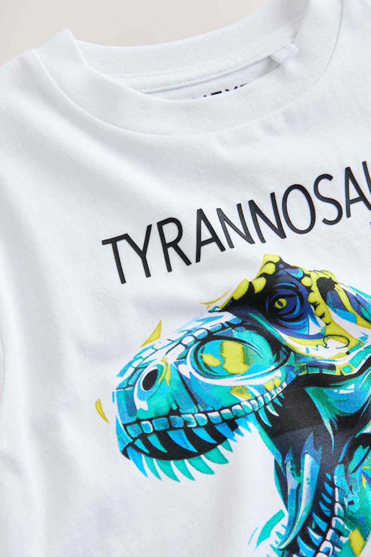 White kids T-shirt close-up, Tyrannosaurus Rex text with blue dinosaur head