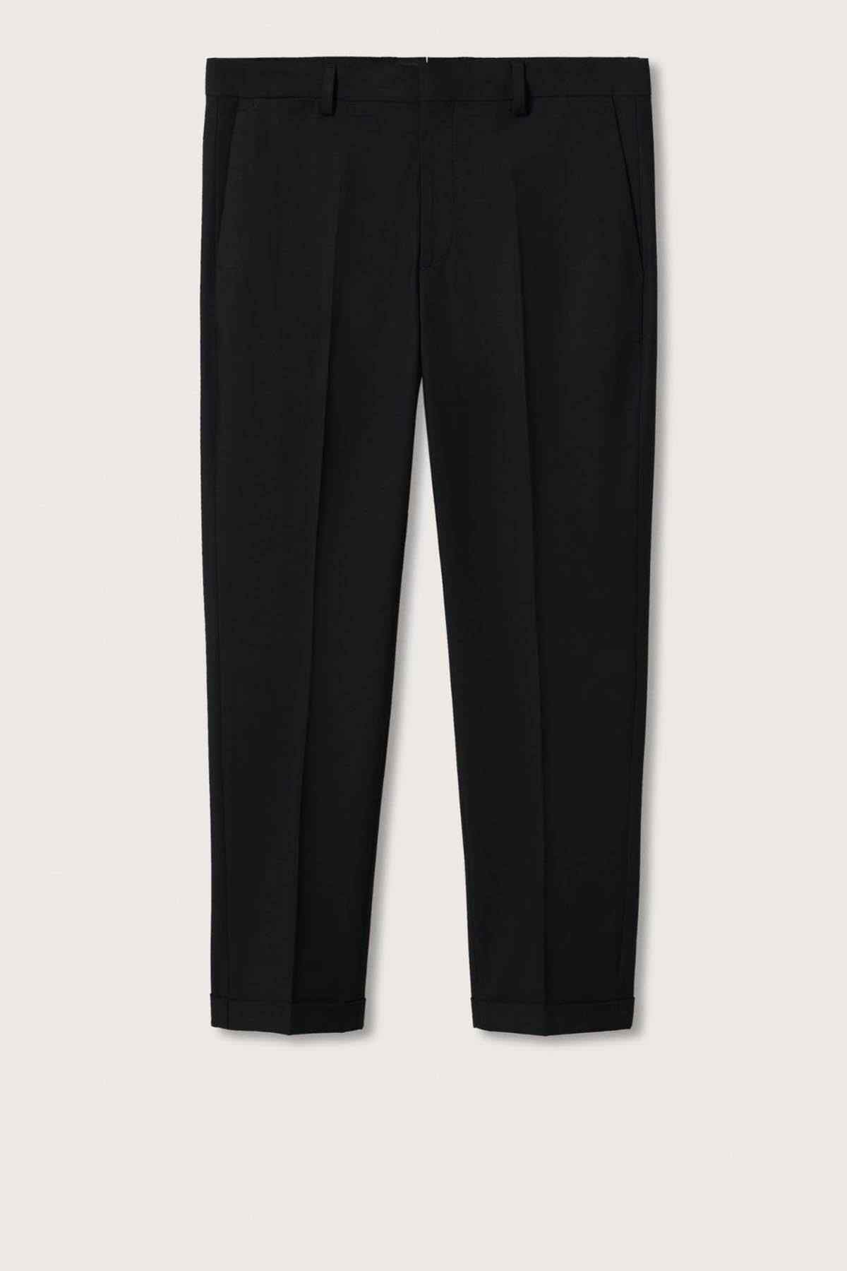 Black tailored trousers flat lay, slim legs with belt loops and button closure