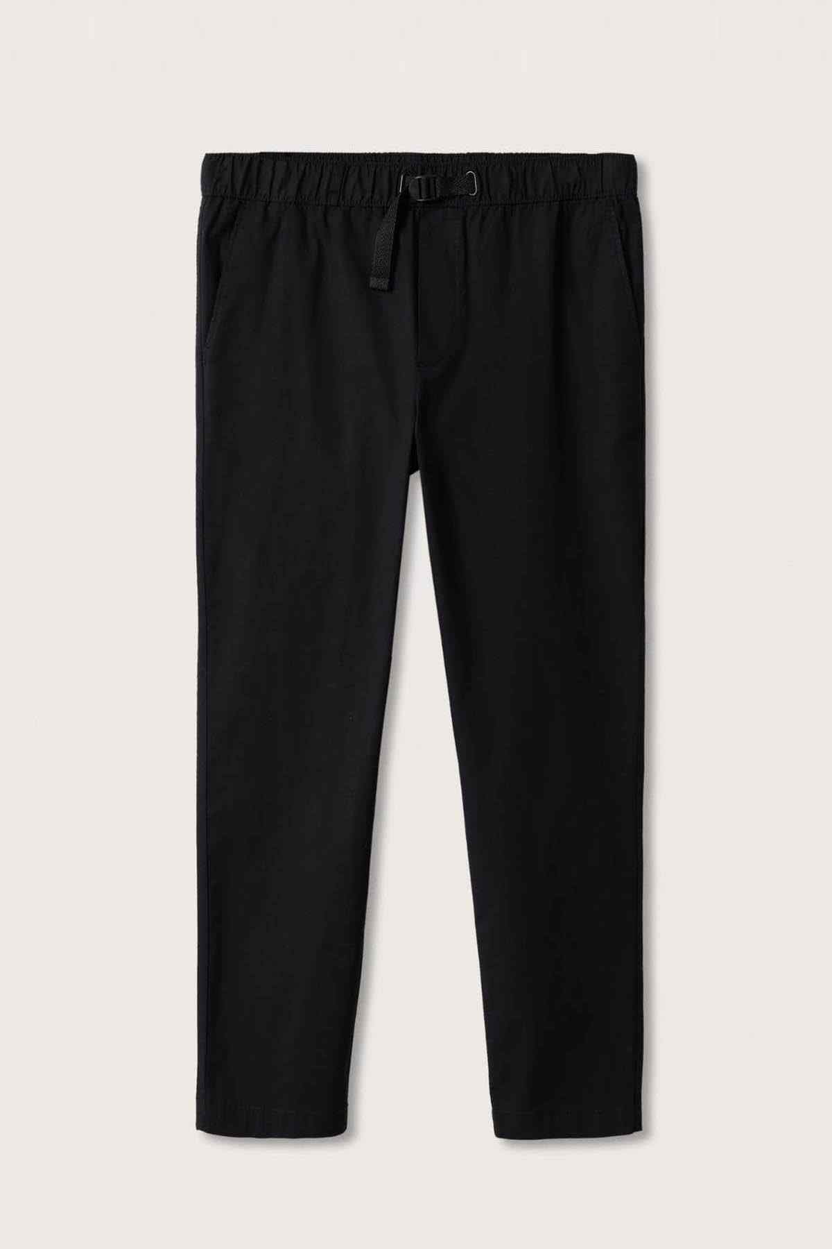 Black tapered pants with belt loops and front seam, cropped full view