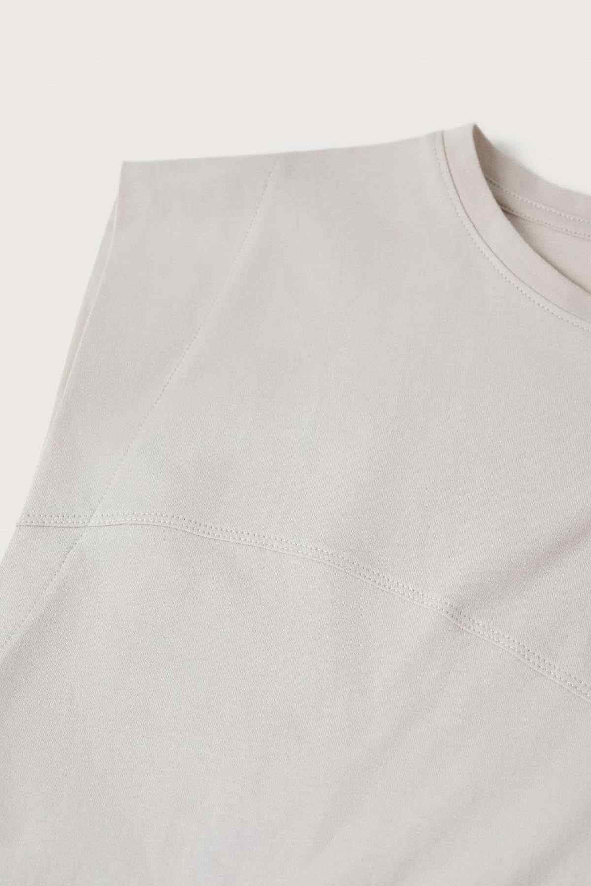 White sleeveless T-shirt chest panel seam and sleeve hem