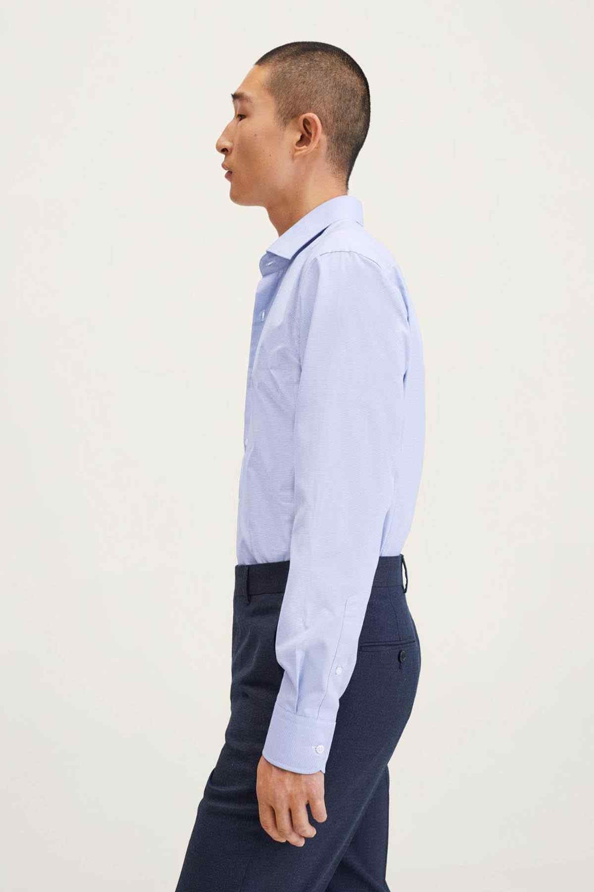 MANGO men's navy suit jacket and trousers, side view