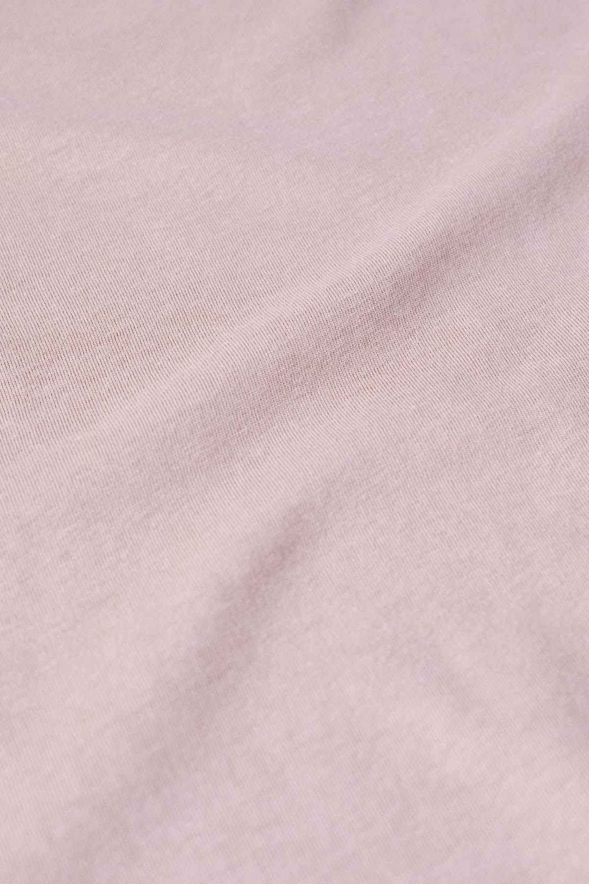 Mauve knit fabric texture close-up