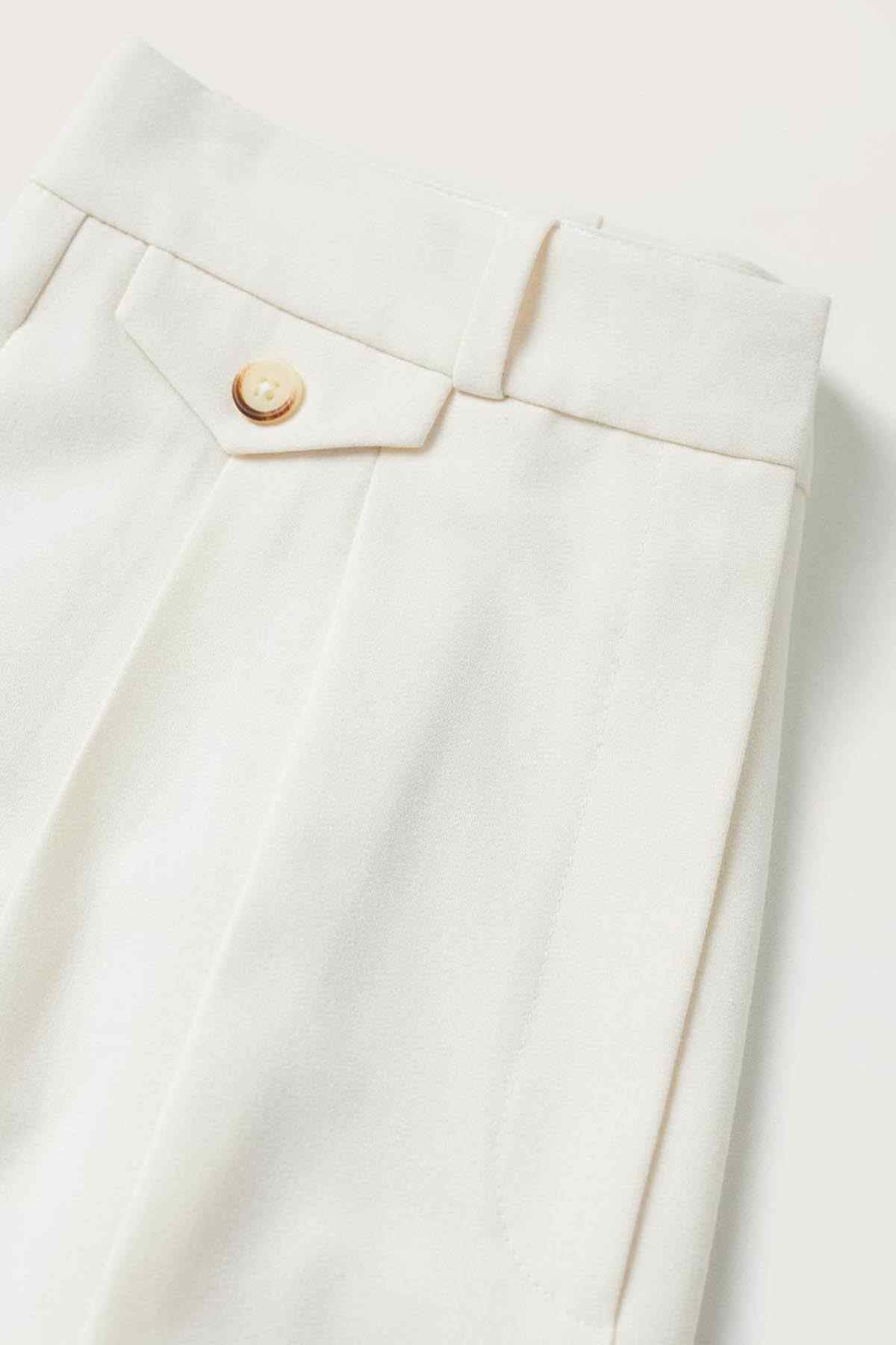 Off-white trousers waistband with belt loops and gold snap button
