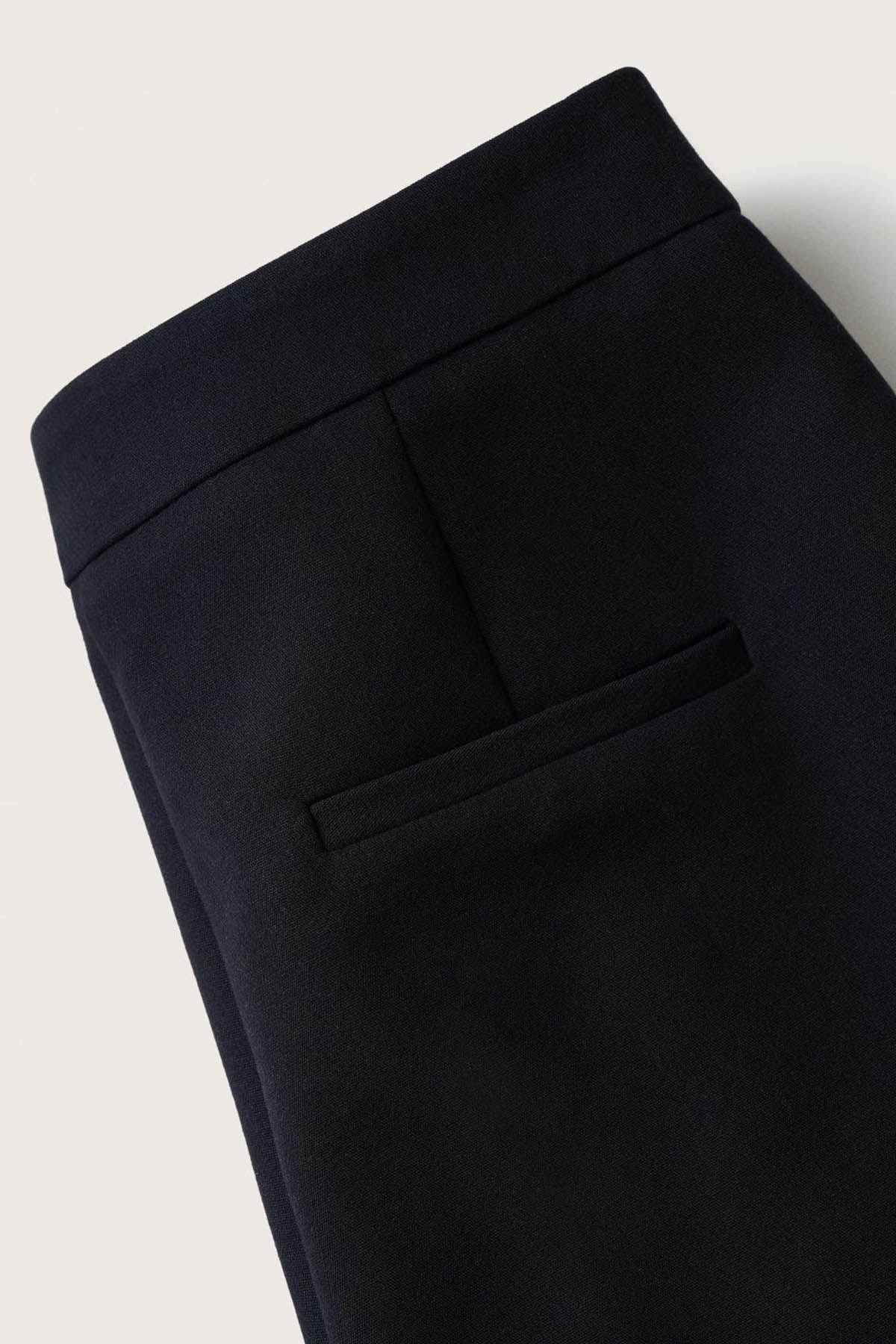 Navy tailored waistband with belt loops and front crease detail