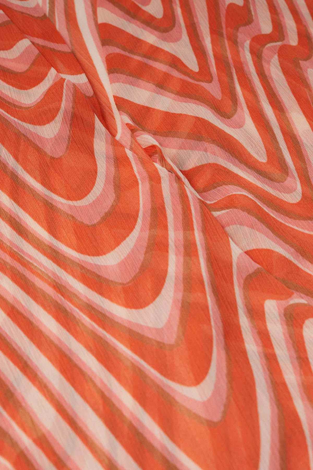 Orange and white wave-print fabric with flowing stripe pattern