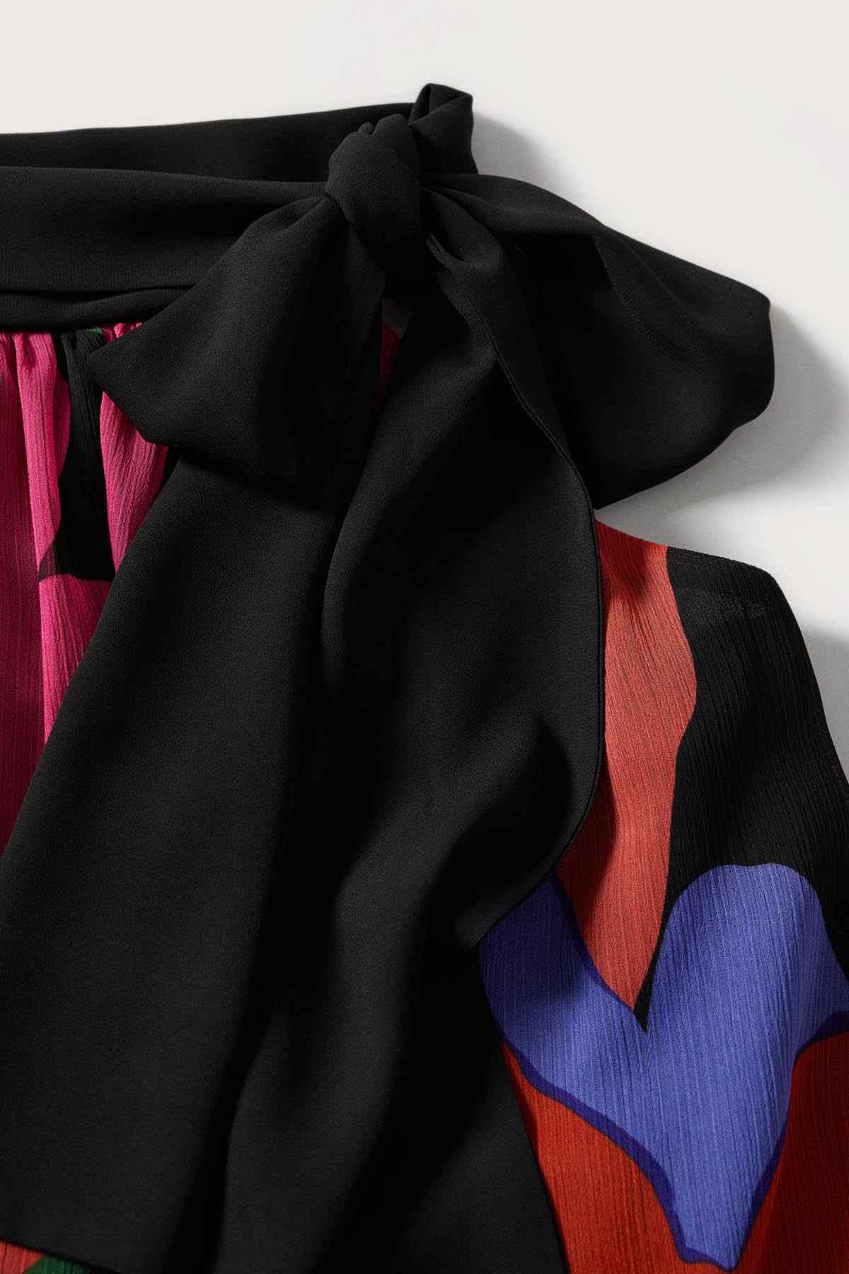 Black neck bow detail on multicolor printed sleeveless dress