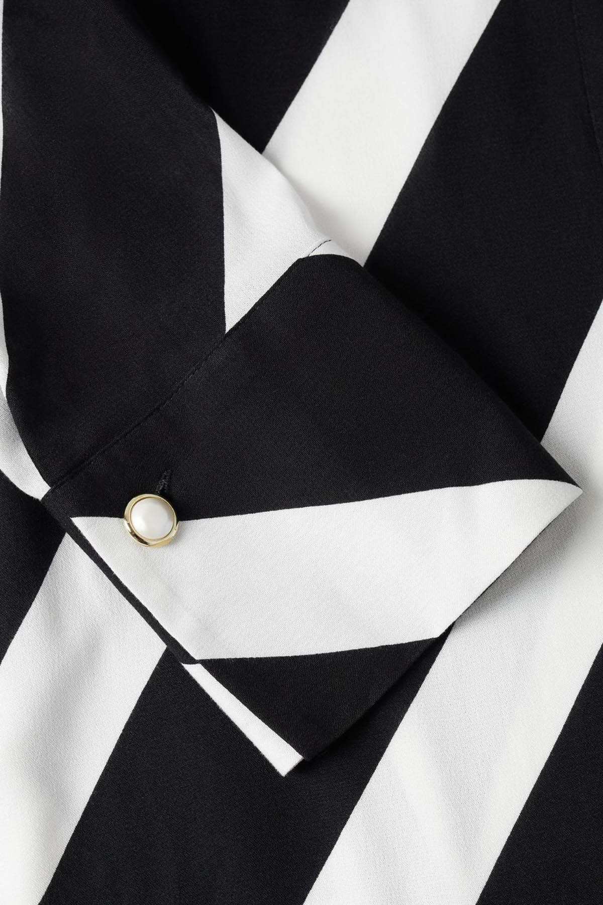 Striped wrap dress tie belt with gold snap detail on black and white fabric