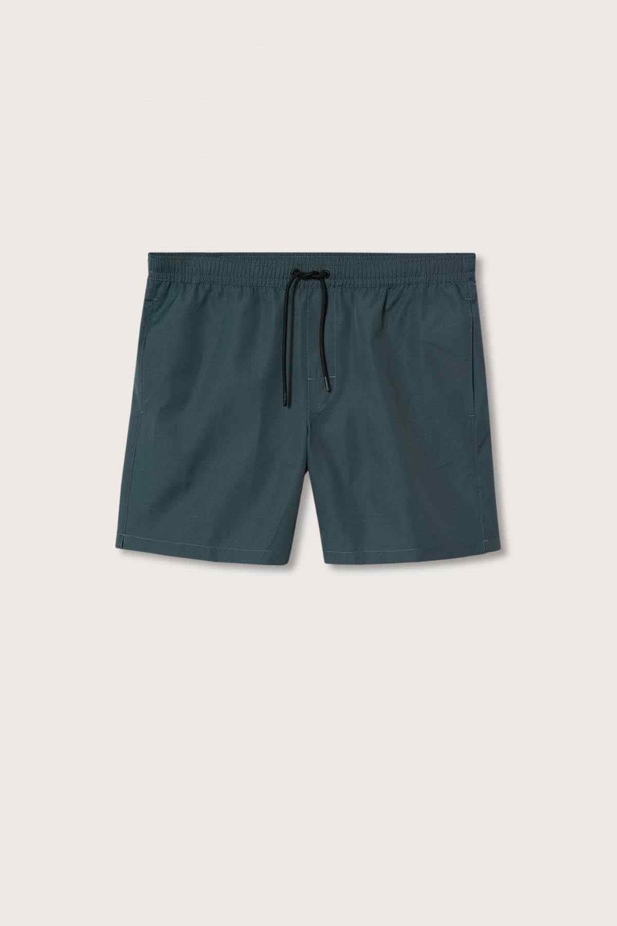 MANGO men's petrol blue swim shorts, flat lay with drawstring waist