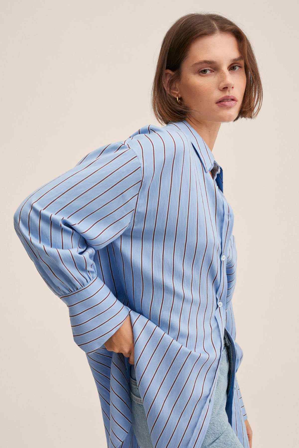 Light blue striped button-up shirt with buttoned cuffs and relaxed shoulder
