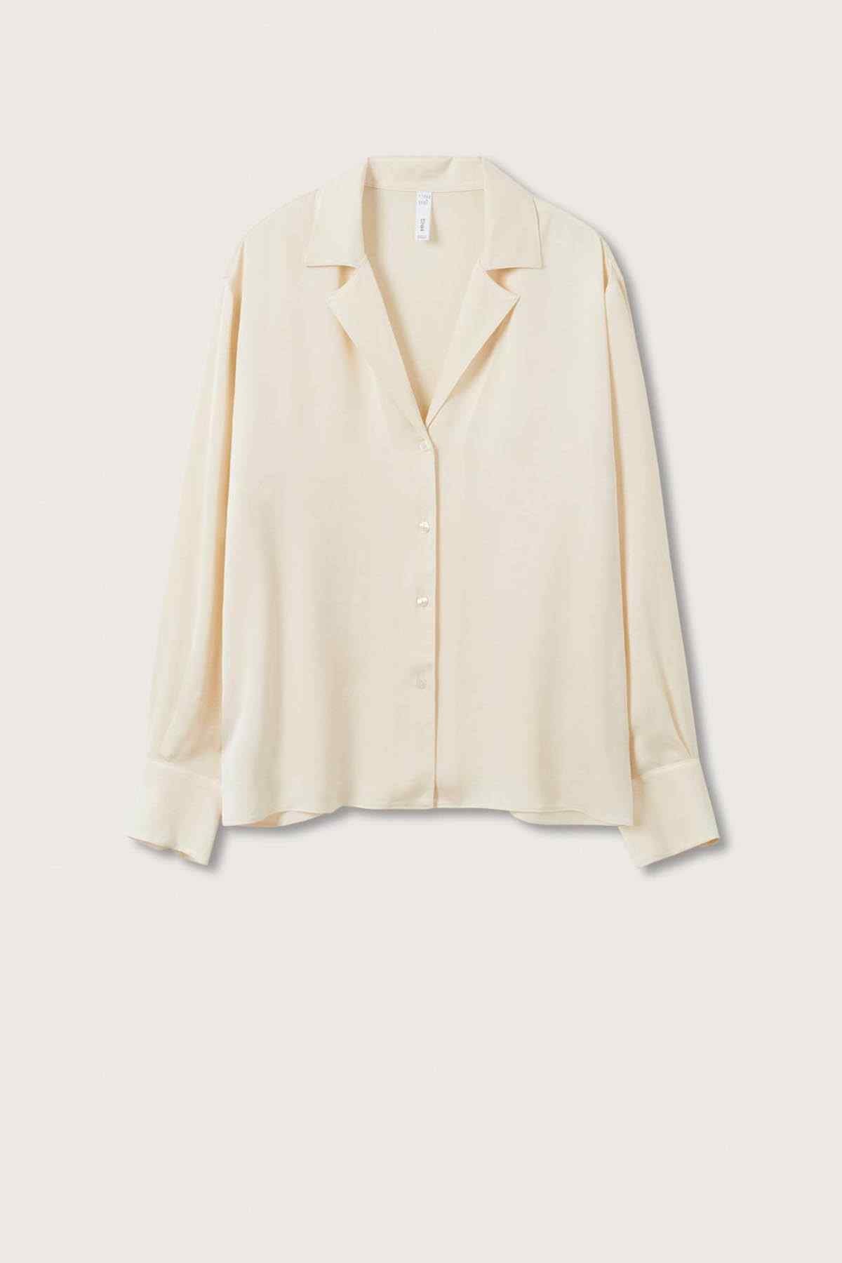 Off-white long-sleeve blouse with V-neck and button front, flat lay.