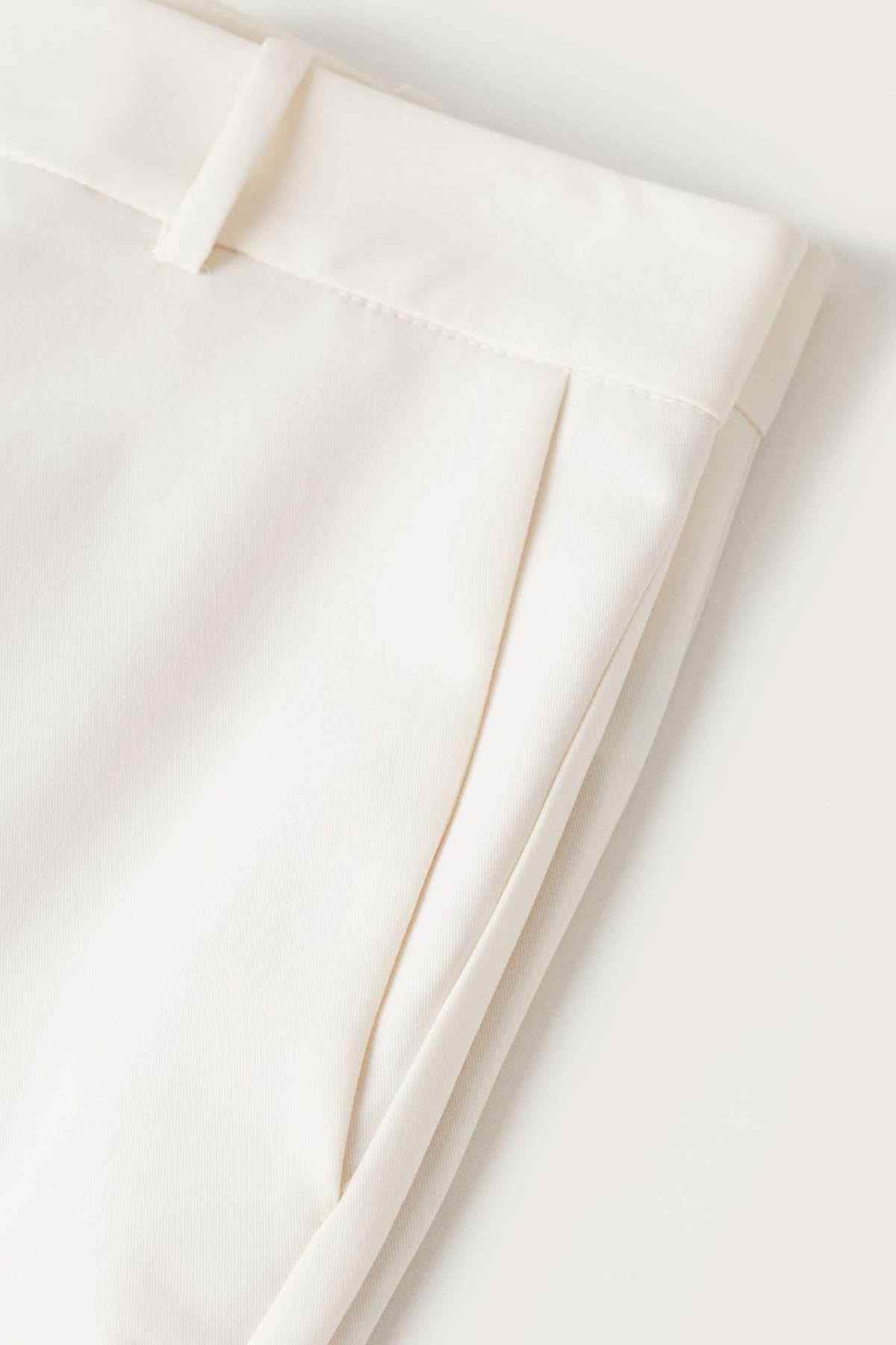 Ecru tailored trousers fabric with seam detail and crease line