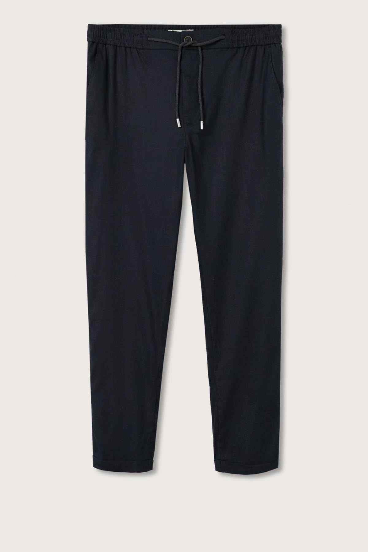 Dark navy drawstring trousers with elastic waistband and tapered legs
