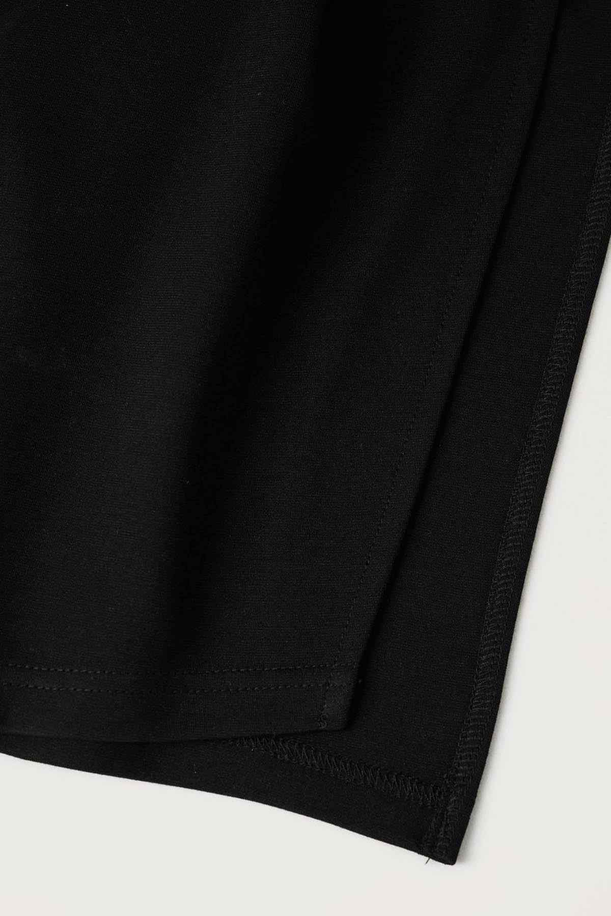 Black knit dress fabric hem and stitching detail